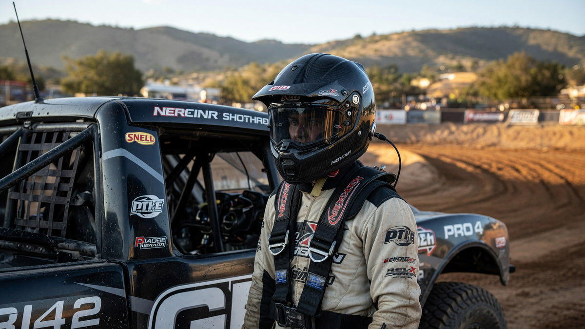 Short-course off-road driver in an SA full-face helmet and NecksGen-style neck restraint at Glen Helen dirt track