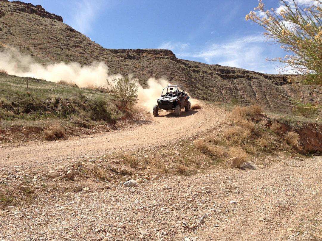 Various off-road racing vehicles competing in different rugged terrain categories
