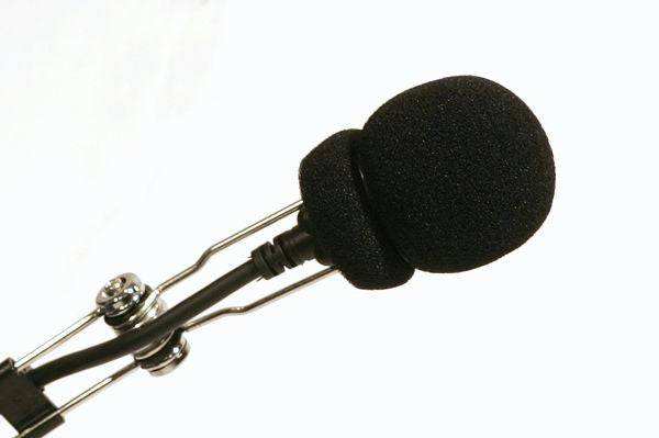 Foam mic sock protecting UTV headset microphone from wind noise and debris