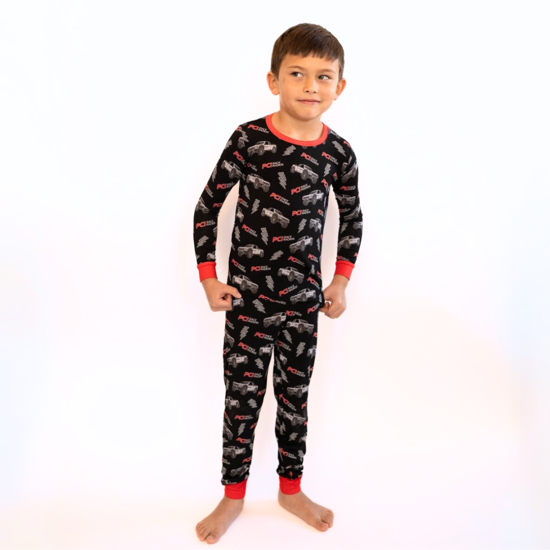 Child wearing PCI Bamboo two-piece long sleeve pajama set in soft breathable fabric