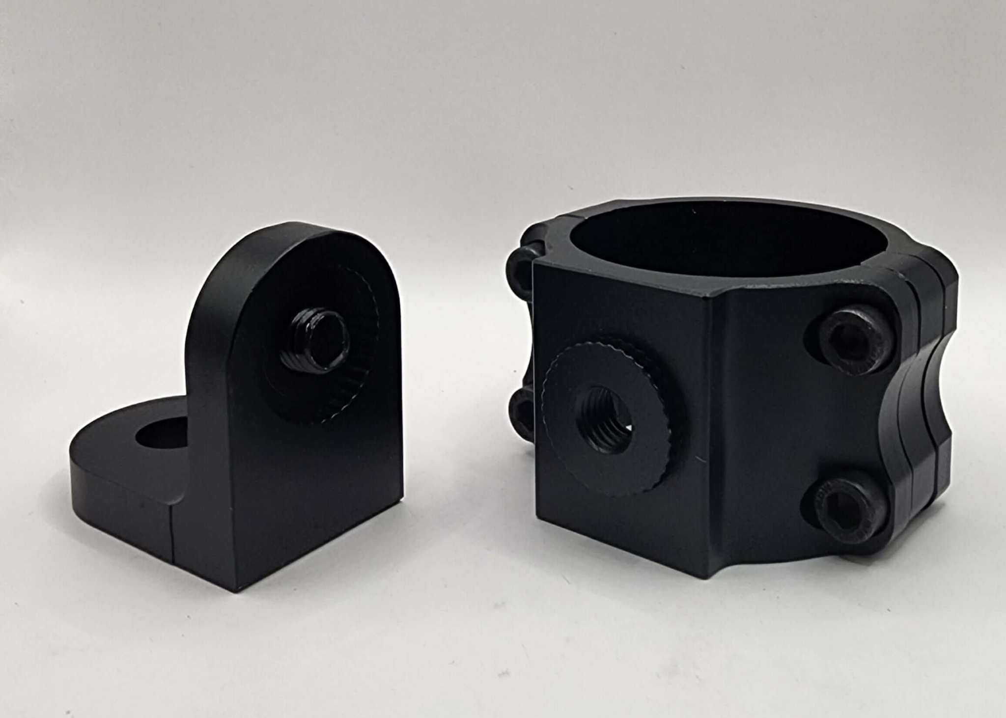 Black anodized aluminum universal whip mounting bracket with adjustable swivel base and hardware for off-road vehicles.