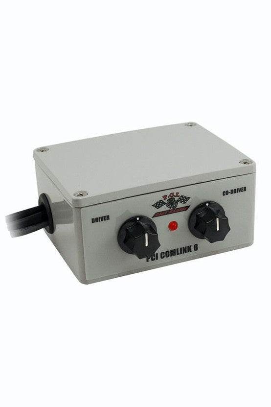 Comlink 6 Racing Intercom in durable water-resistant case with controls for driver and co-driver.