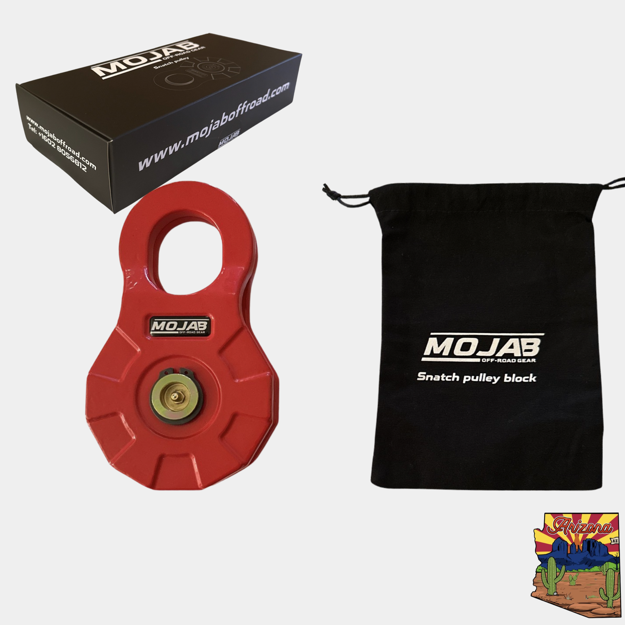 Red forged steel snatch pulley block with brass greasing hardware, black canvas storage bag, and branded box for off-road recovery gear.