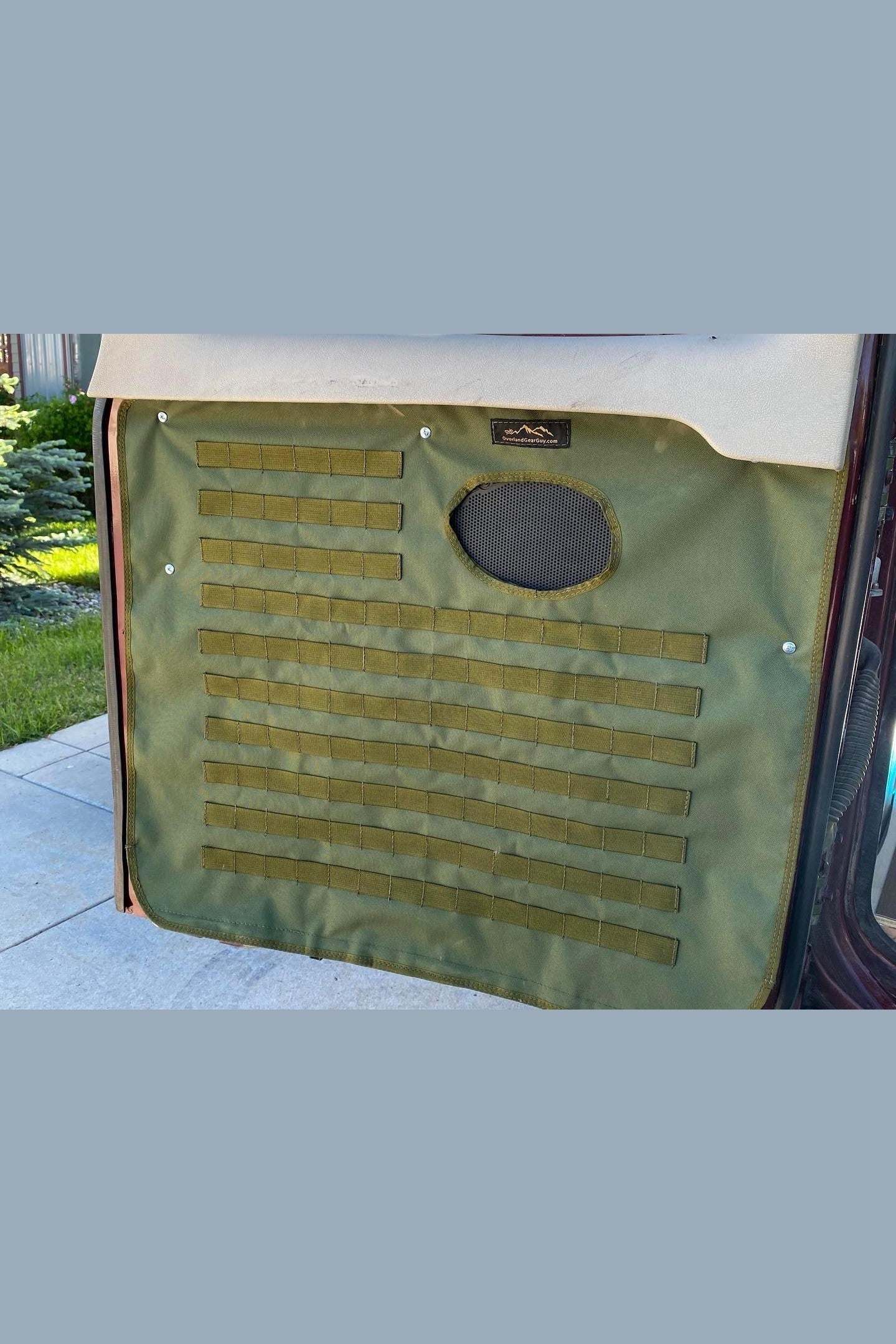 Ford Econoline back door panel organizer in green fabric installed on van door for storage and organization
