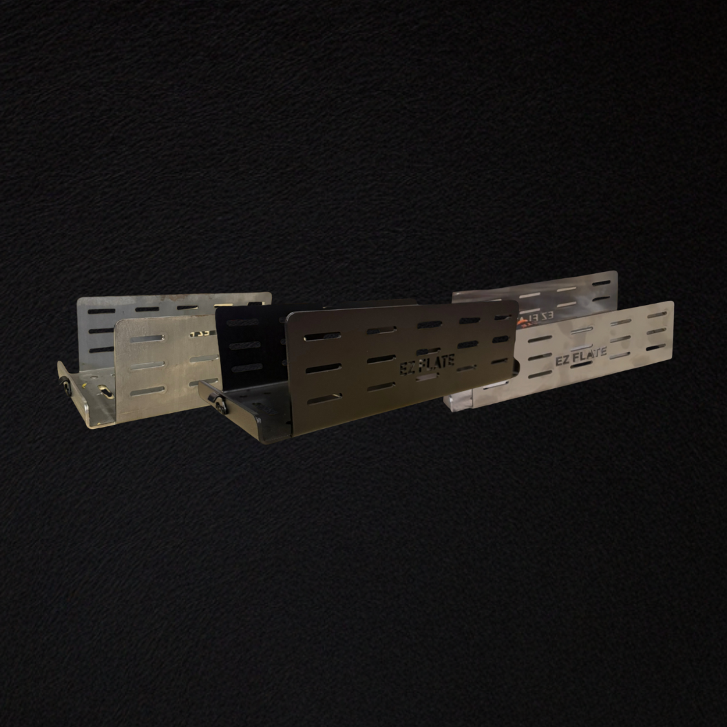 Lock 'N Load Universal Compressor Mount in black powder coat, raw steel, and stainless steel finishes for secure off-road compressor installation