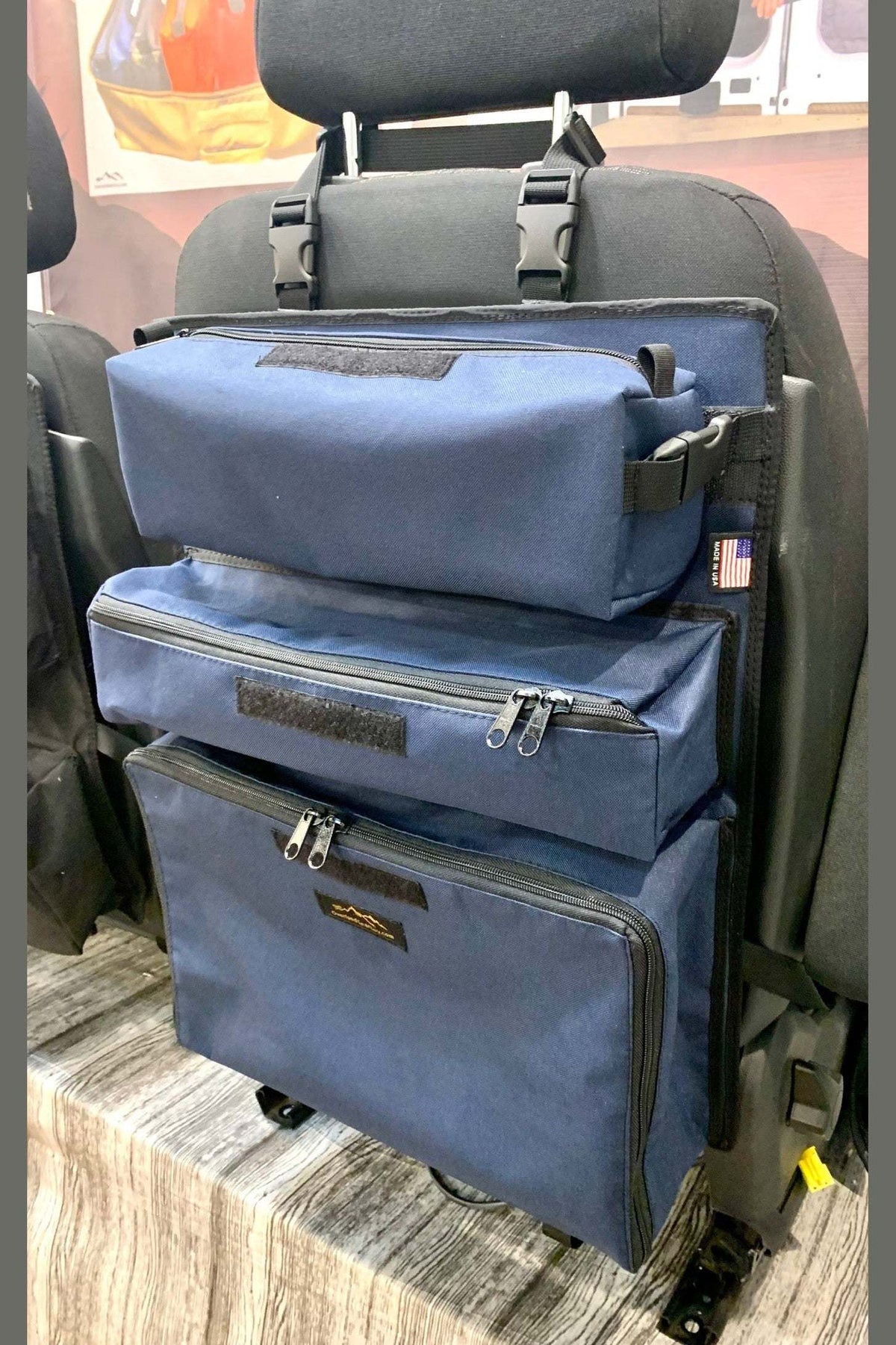 Arches Overlander 1 Seat Organizer with spacious cargo pockets and durable construction, installed in a vehicle seat.
