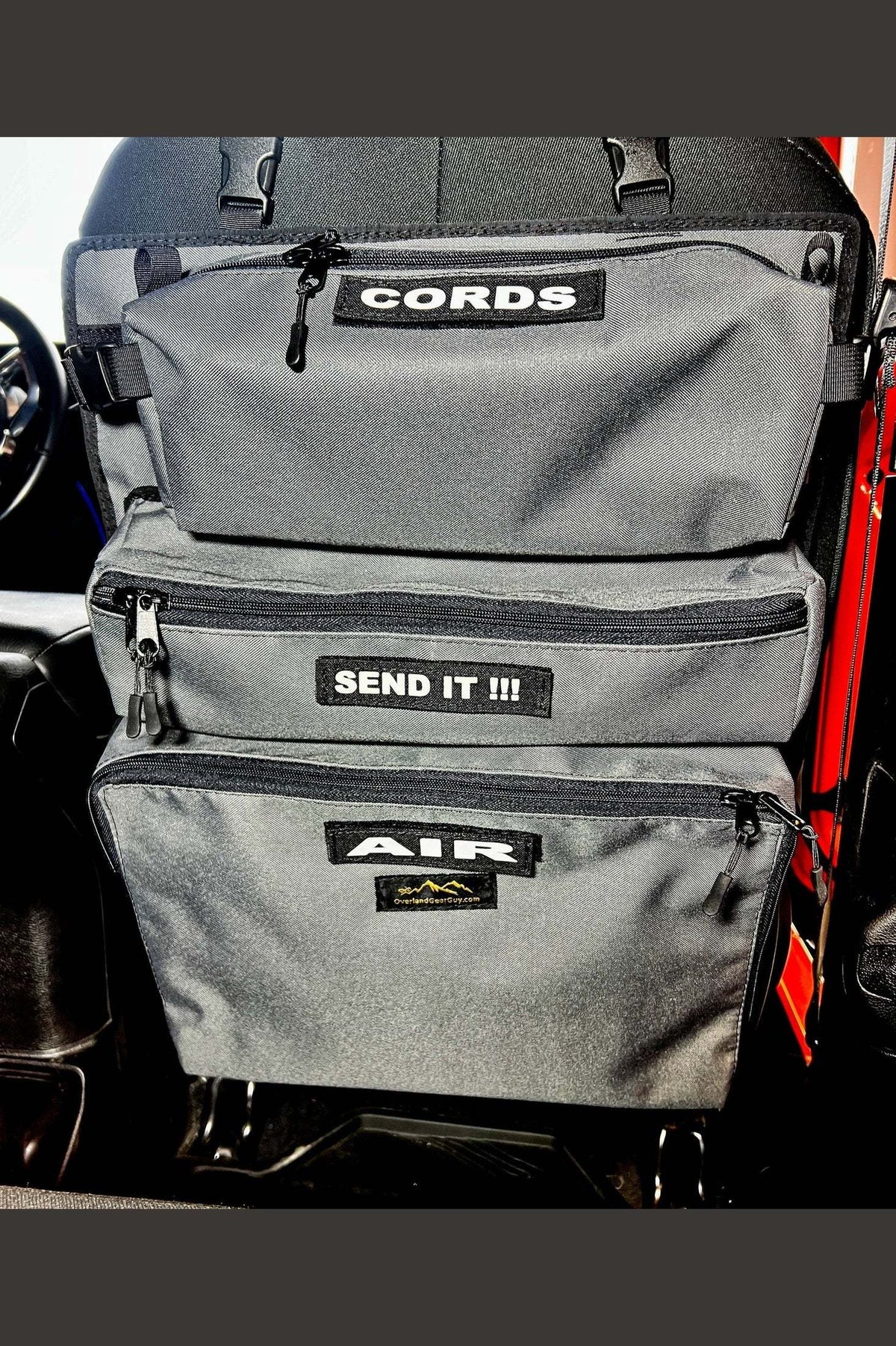 Arches Overlander 1 Seat Organizer with spacious pockets attached to a car seat.