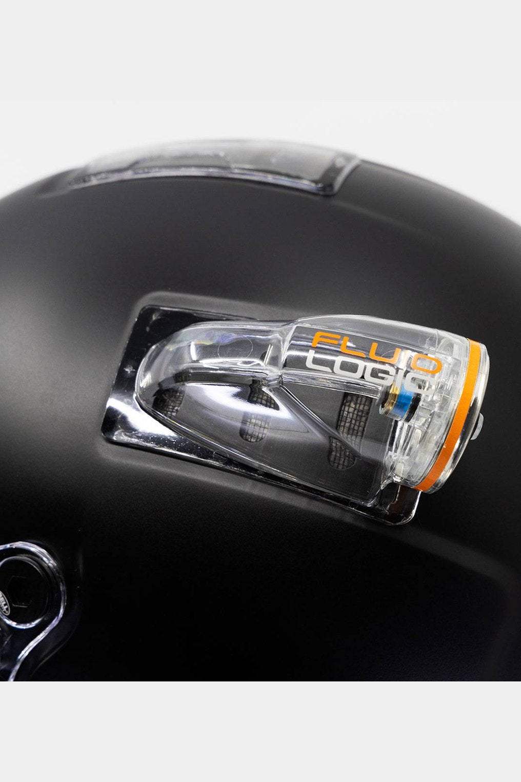 FluidLogic fitting installed on black Bell BR8 helmet for pro installation with Maglock compatibility