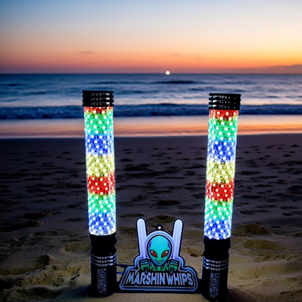 Big Moe 2.0 RGB fat whip lights with vibrant multicolor LEDs on beach at sunset, Marshin Whips logo in foreground