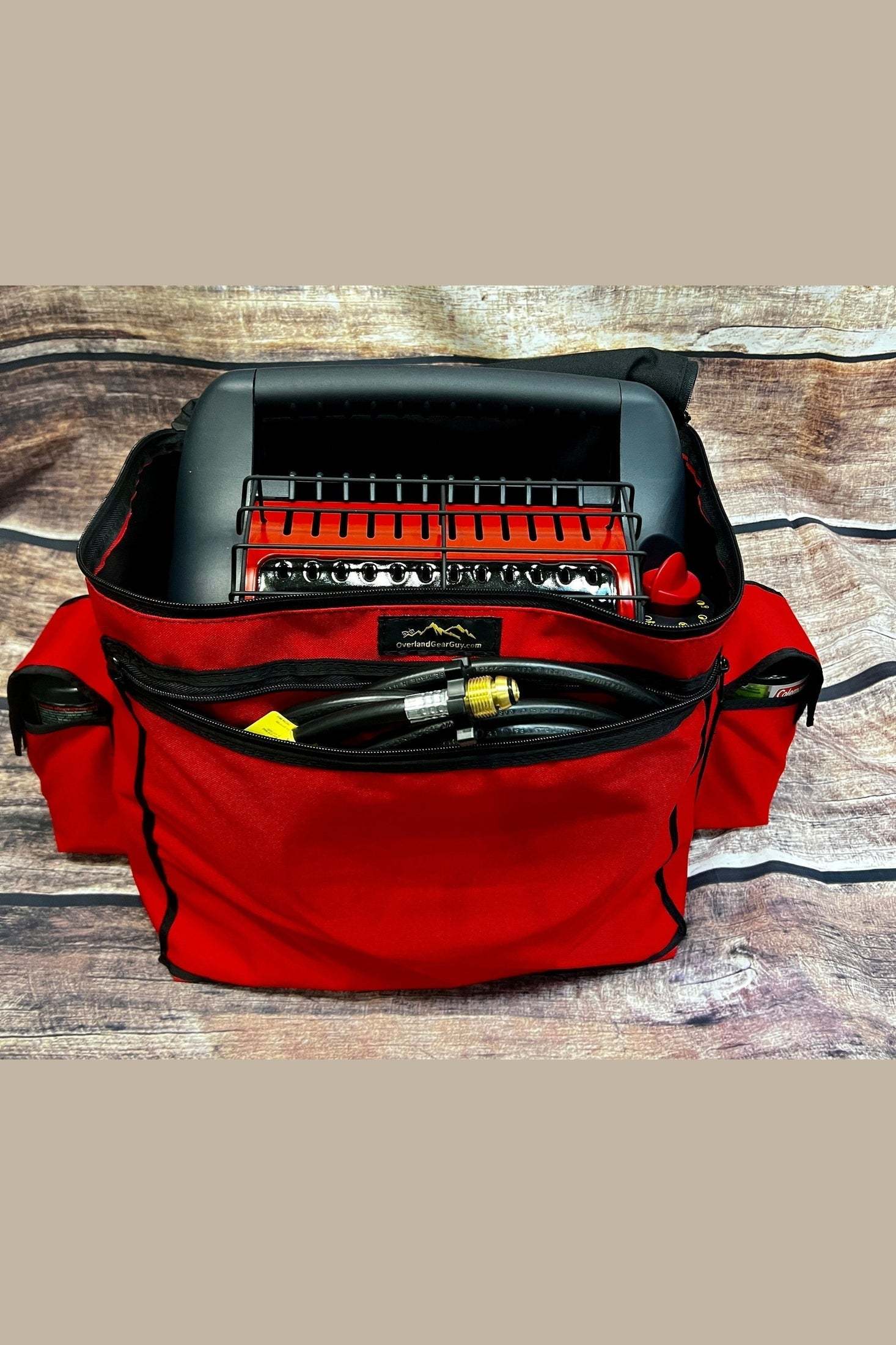Red Big Buddy Heater Bag with carry handle, zippered top, and side pouches for propane tanks and accessories.