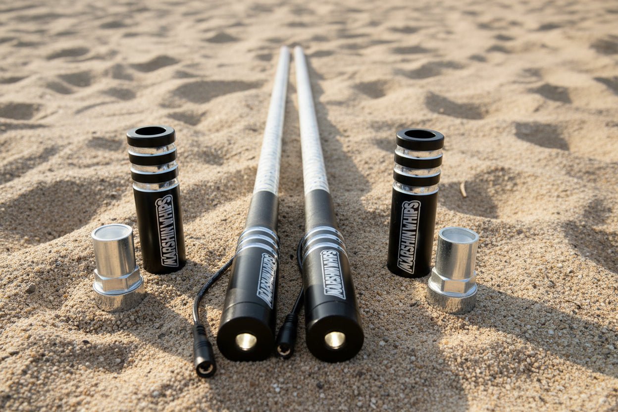 Game Changer black offroad LED whip set with magnetic mounts on sand