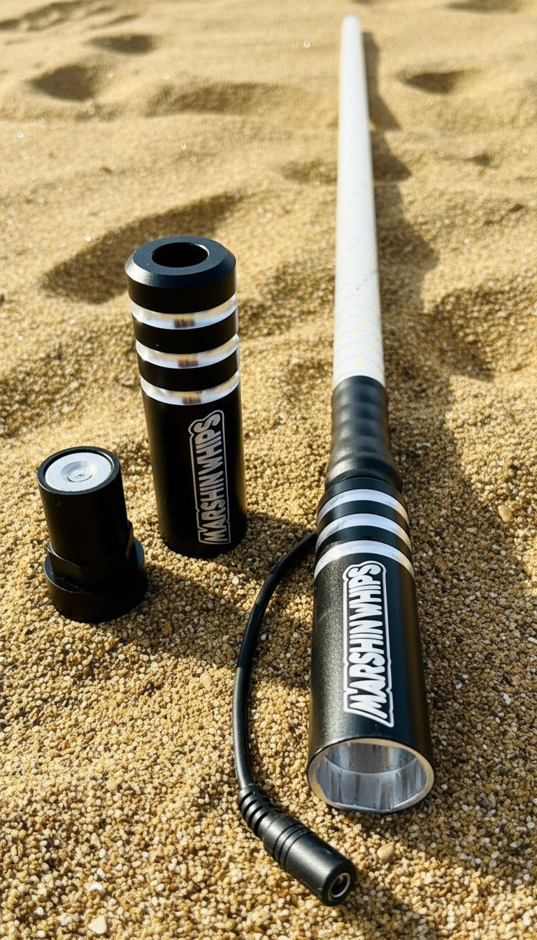 Game Changer black single whip with magnetic base and bright LEDs on sandy terrain