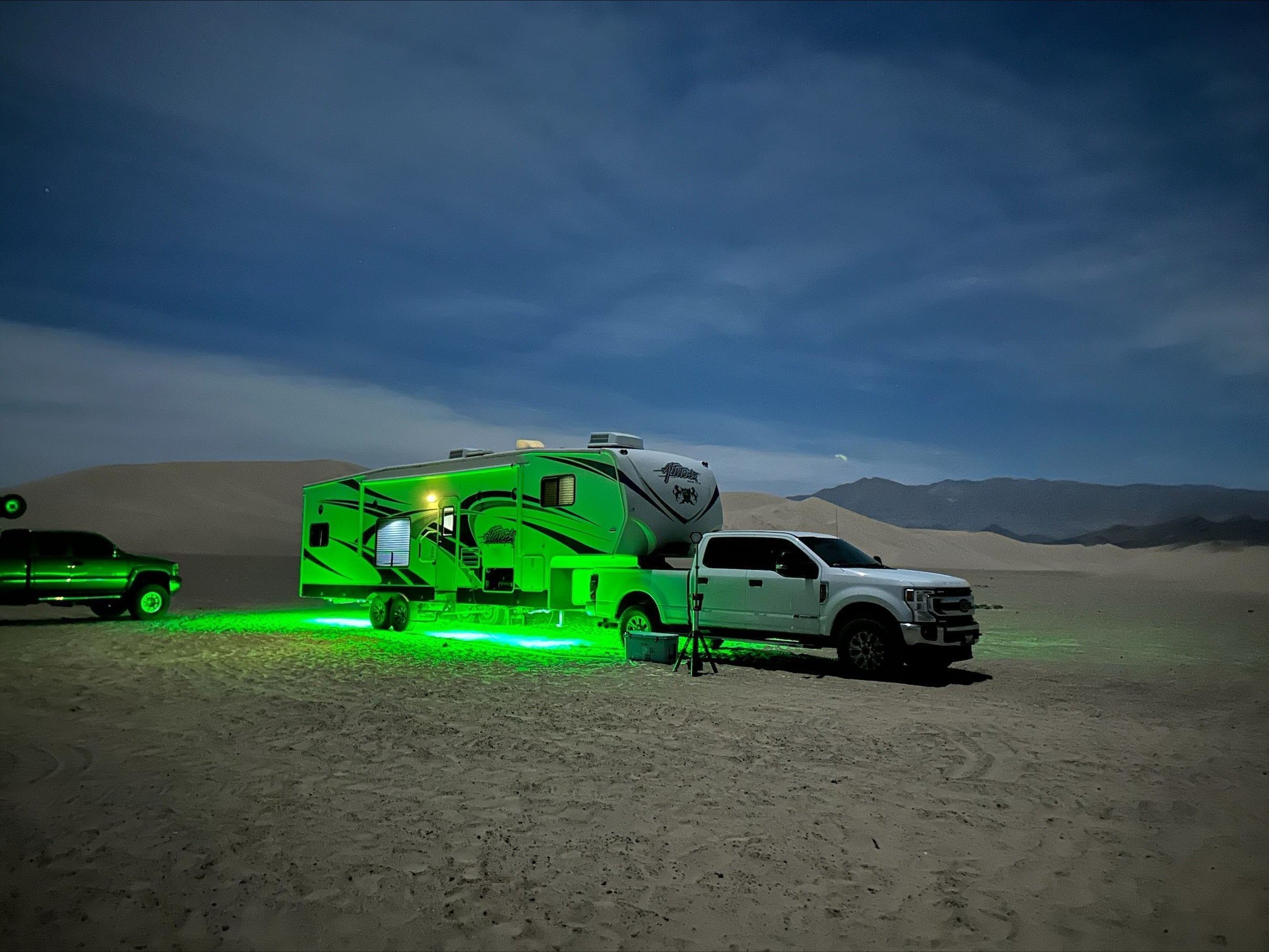 RV with colorful underglow LED lights controlled by app for enhanced style and visibility