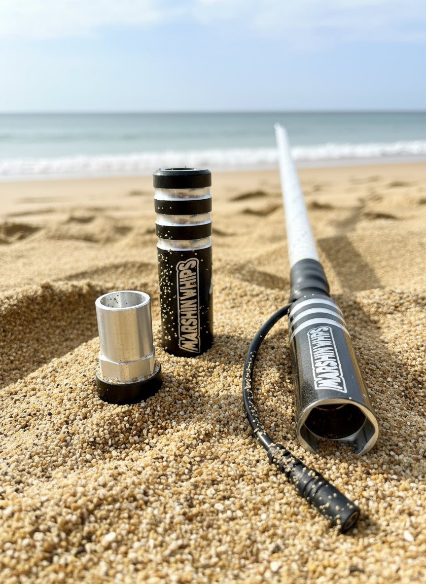 Game Changer Crystal Grey off-road whip with magnetic base and LED light on sandy beach