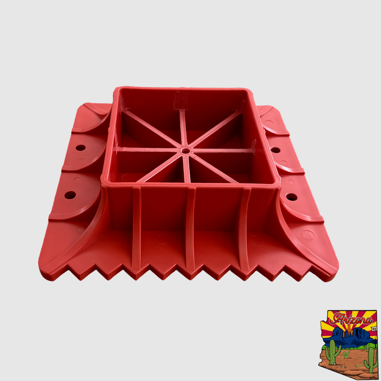 Red extended jack base with non-slip textured surface for stability and support on soft terrain