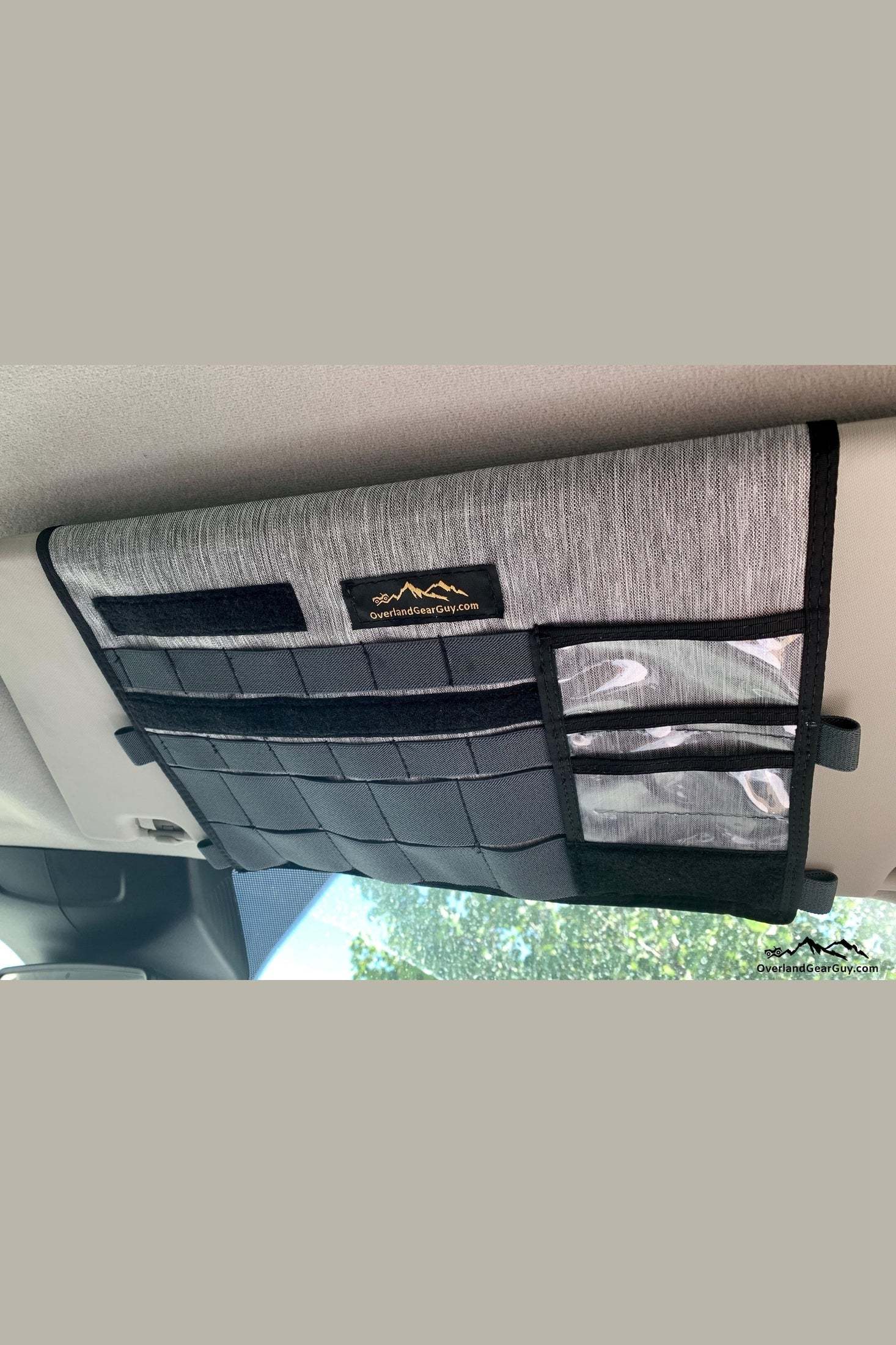Ford Transit visor organizer with built-in mirror and multiple storage compartments attached to sun visor