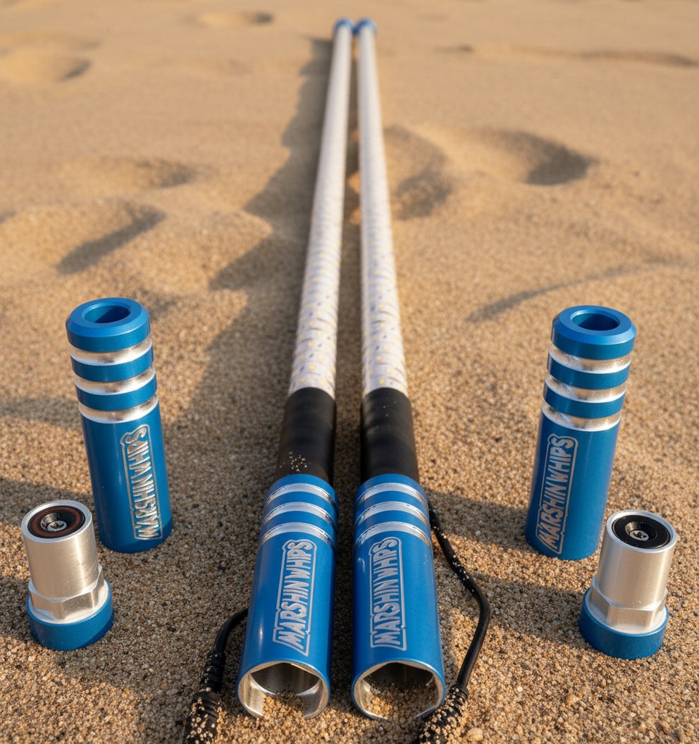 Game Changer blue off-road whips with LED lights and magnetic base set on sand