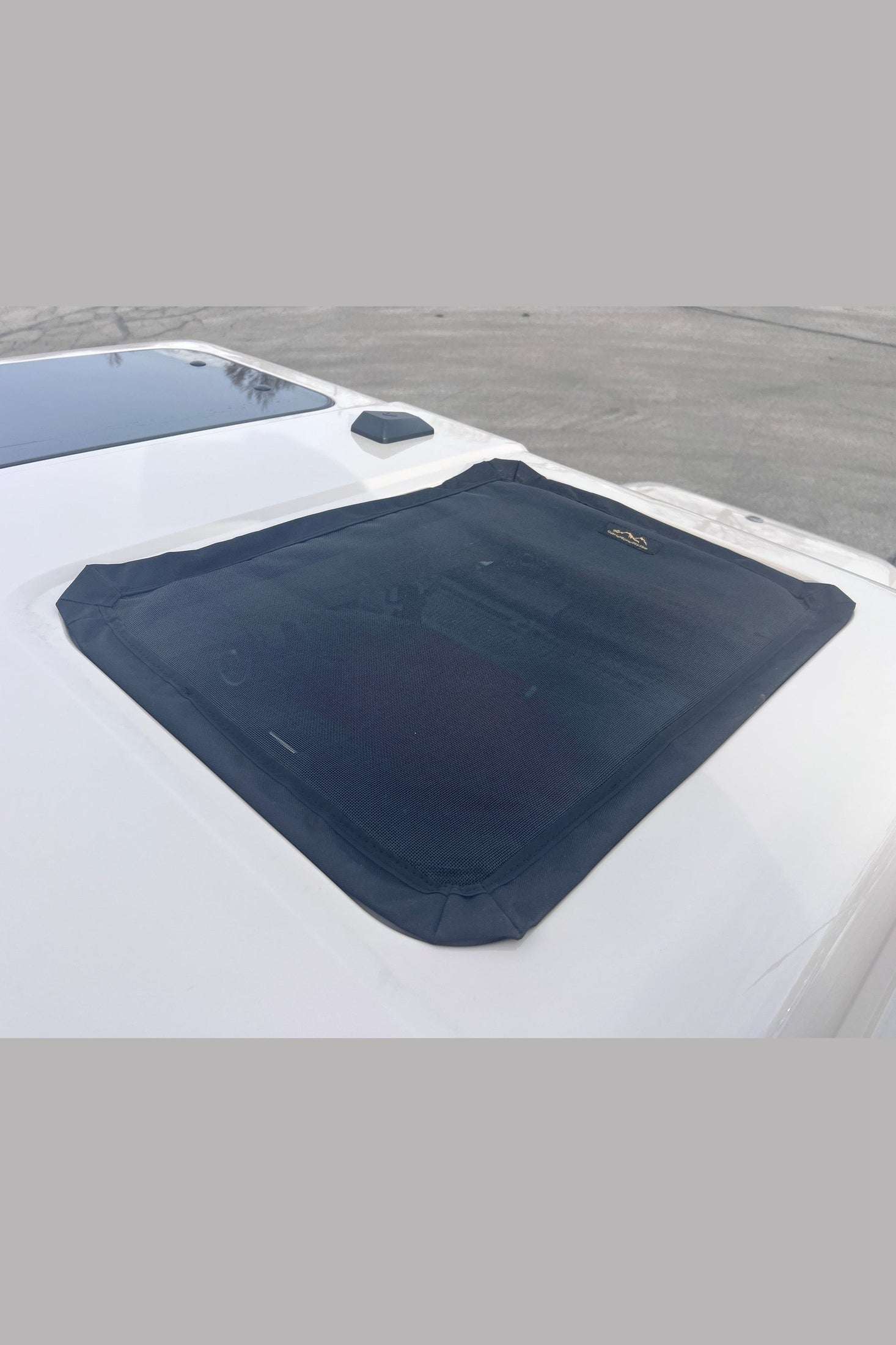 INEOS Grenadier Safari Window Screens on vehicle, custom-fit mesh for insect protection and airflow.