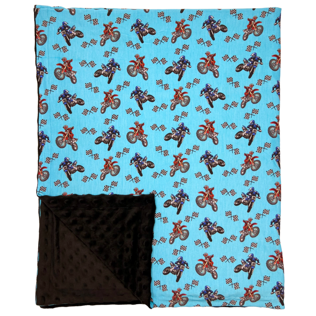 Bamboo Minky Blanket with blue motocross bike print and soft black minky reverse side, lightweight and reversible baby blanket