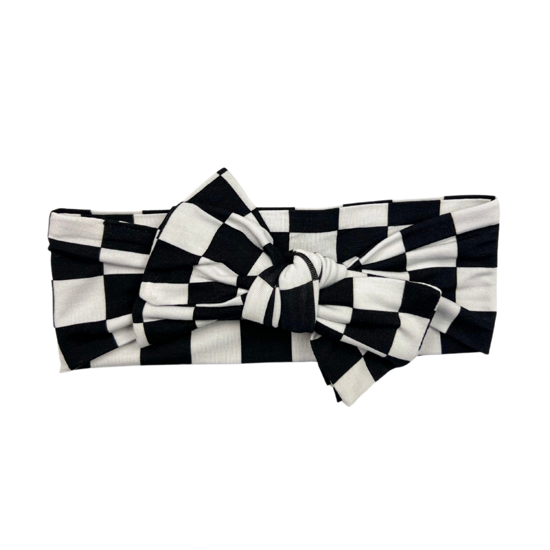 Black and white checkered bamboo headband with adjustable bow for kids, soft and comfortable fit