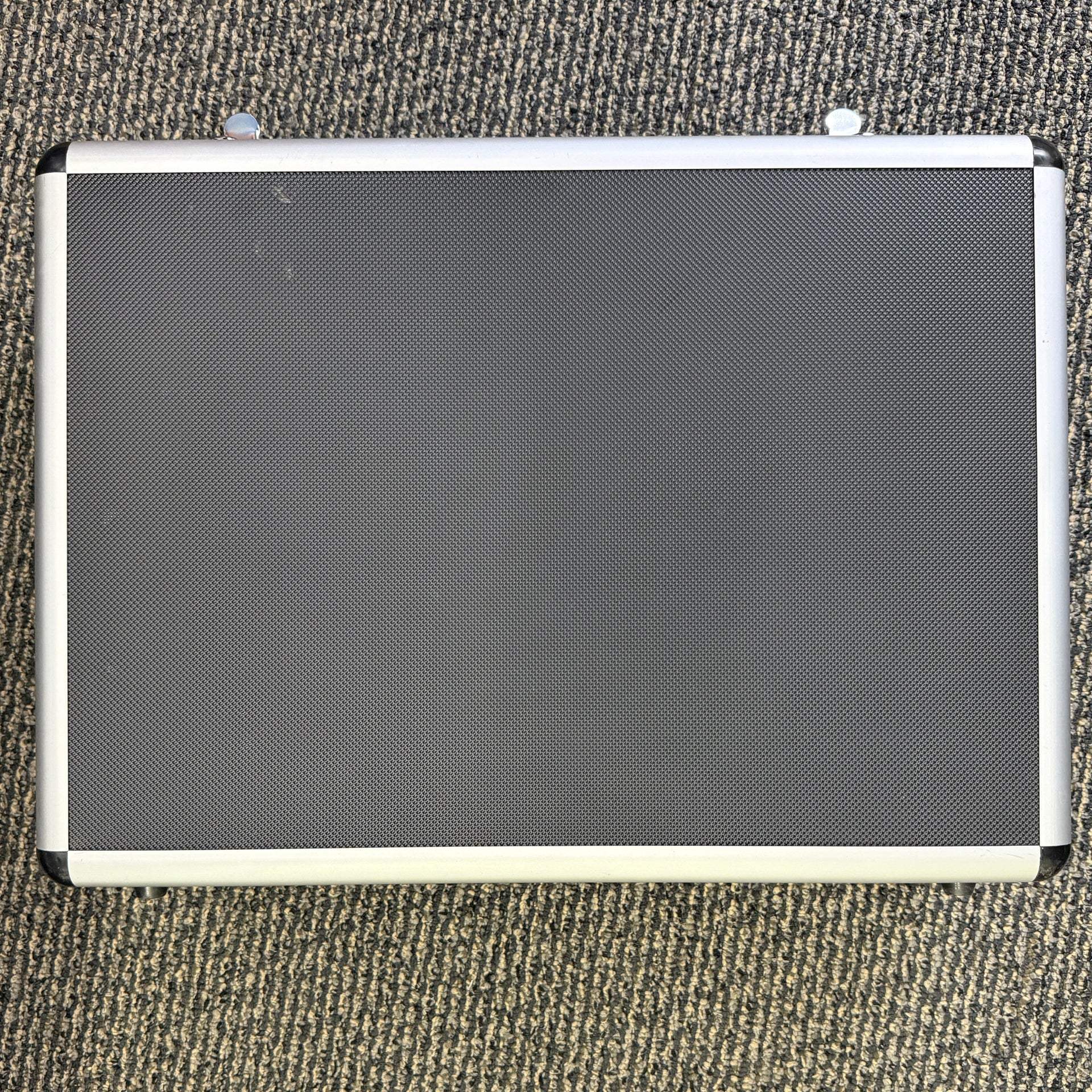 Clearance aluminum carrying case with double locks, handle, shoulder strap, and organized compartments showing signs of internal padding use