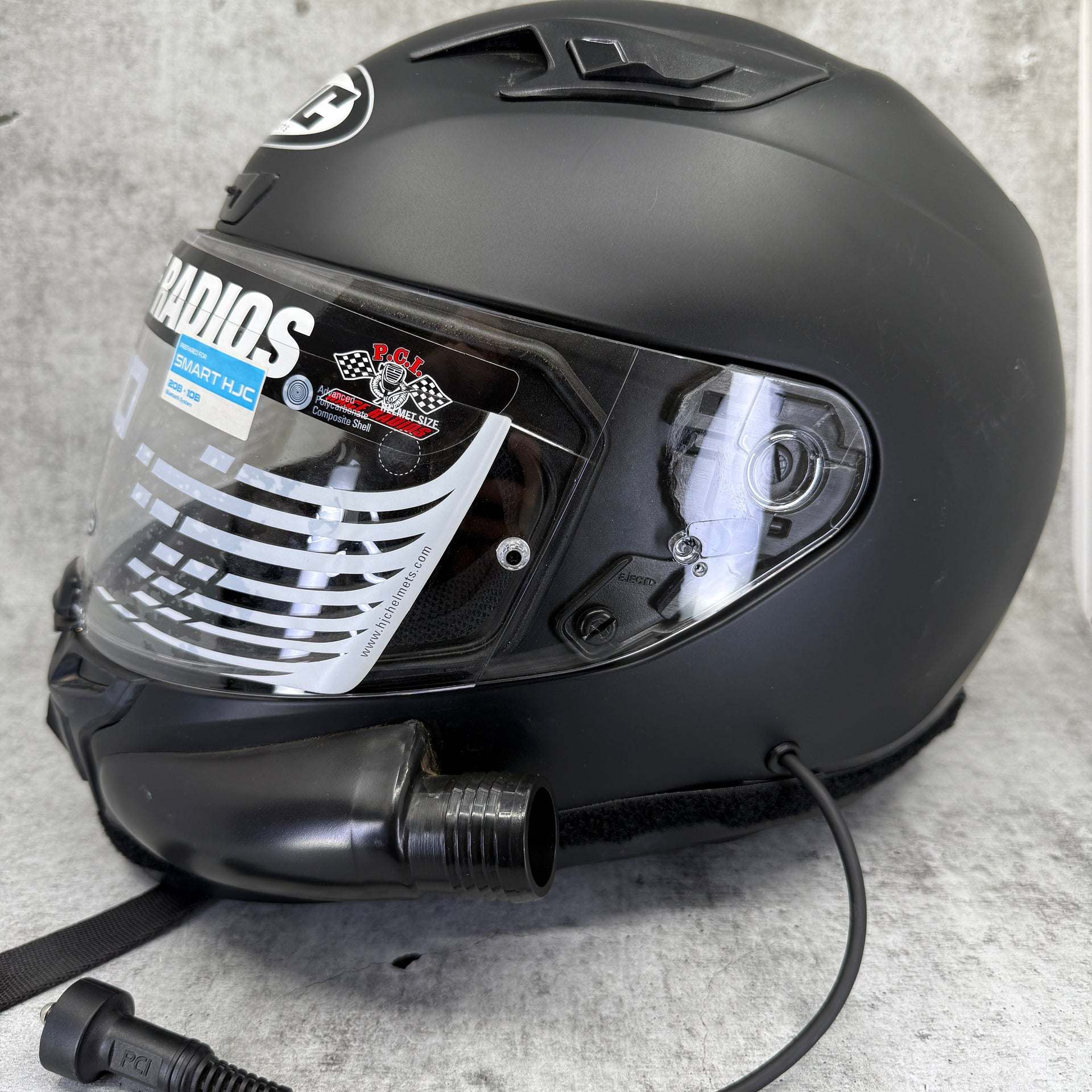 Black HJC i10 DOT Helmet with scratches and blemishes, high usage display model