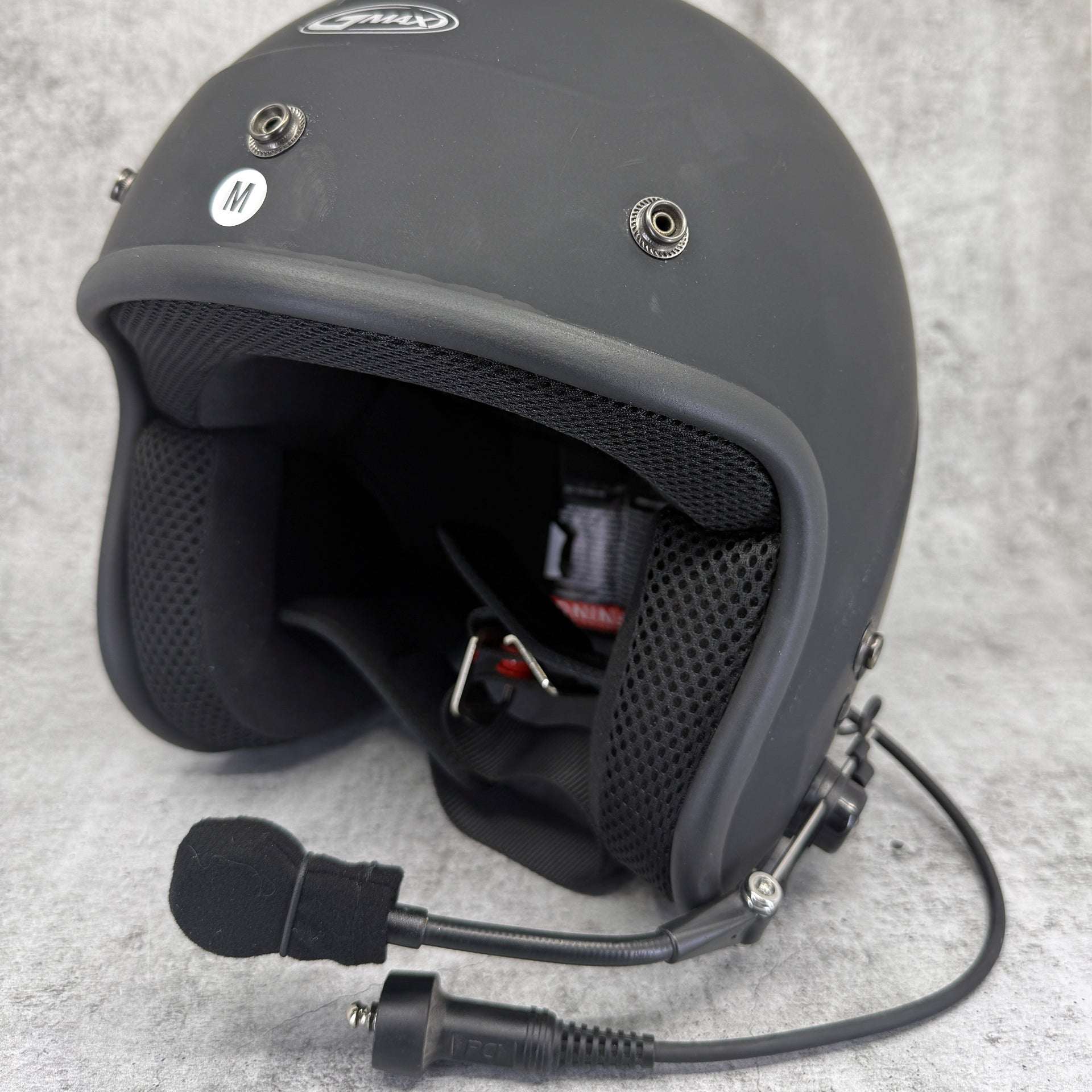 Clearance GMax OF-2 open face motorcycle helmet without visor, showing wear and removable liners.