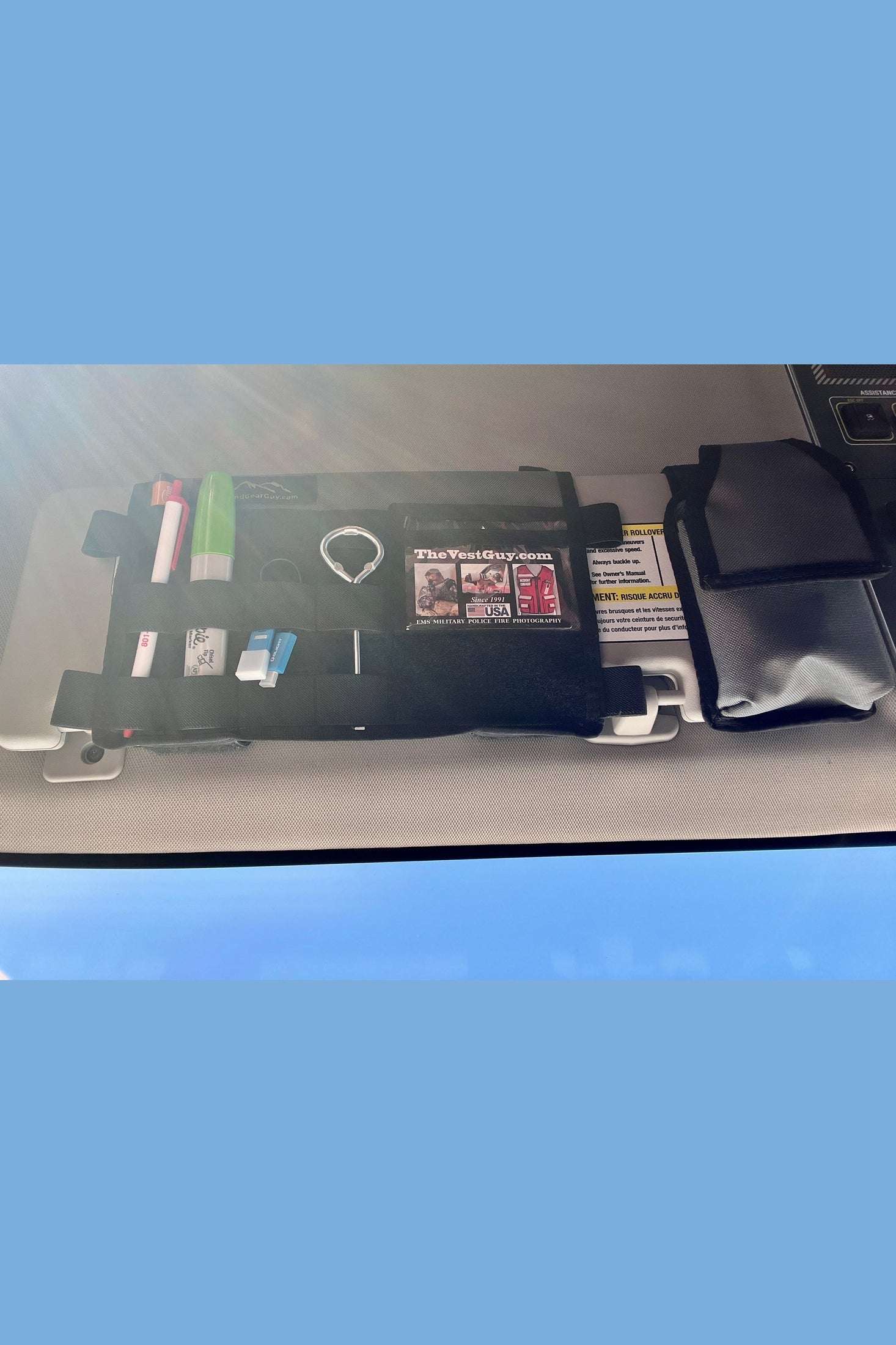 INEOS Grenadier MOLLE Visor Organizer installed with compartments for organizing gear.