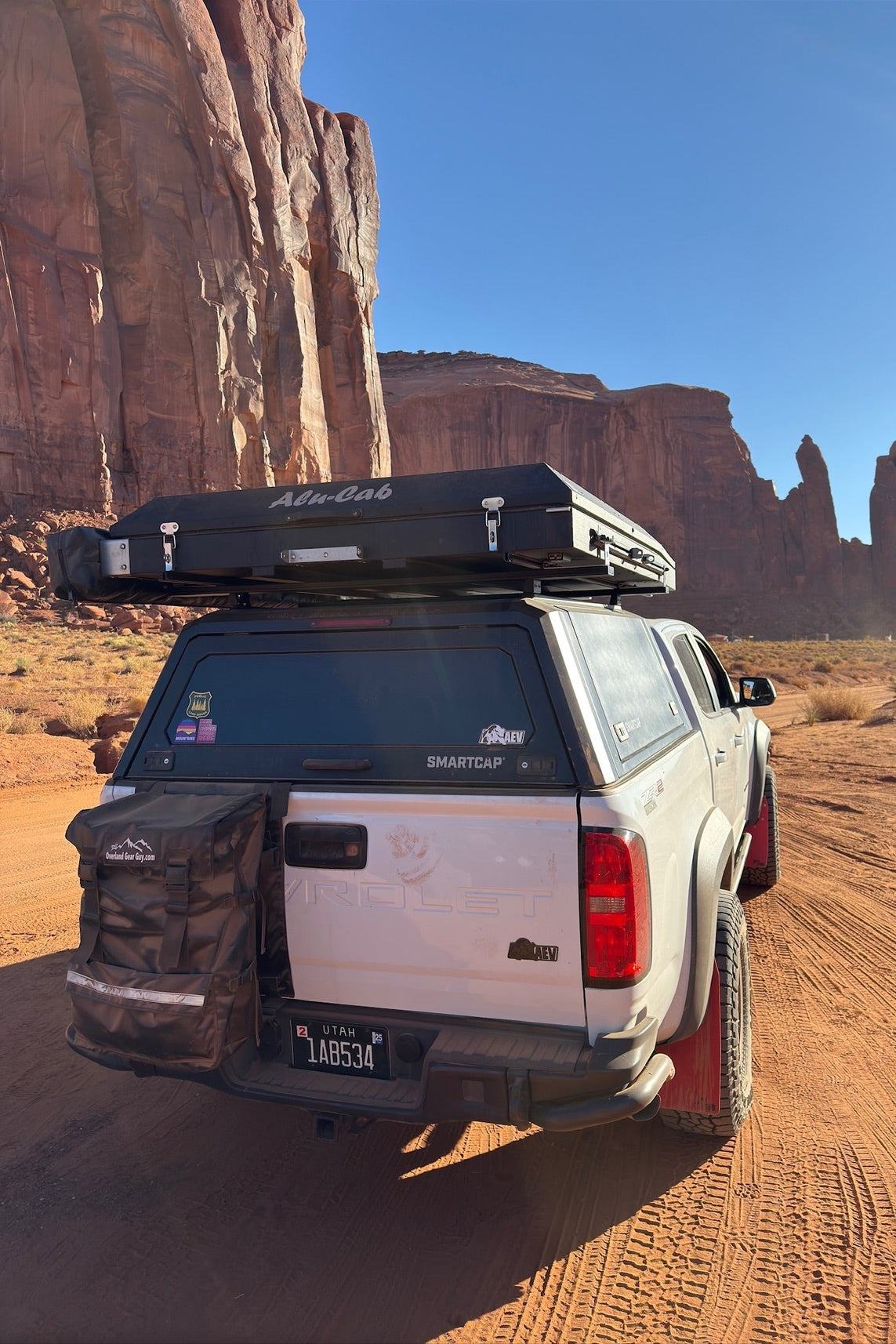 Max Adventure Tailgate Trash Bag mounted on pickup truck in desert outdoor setting