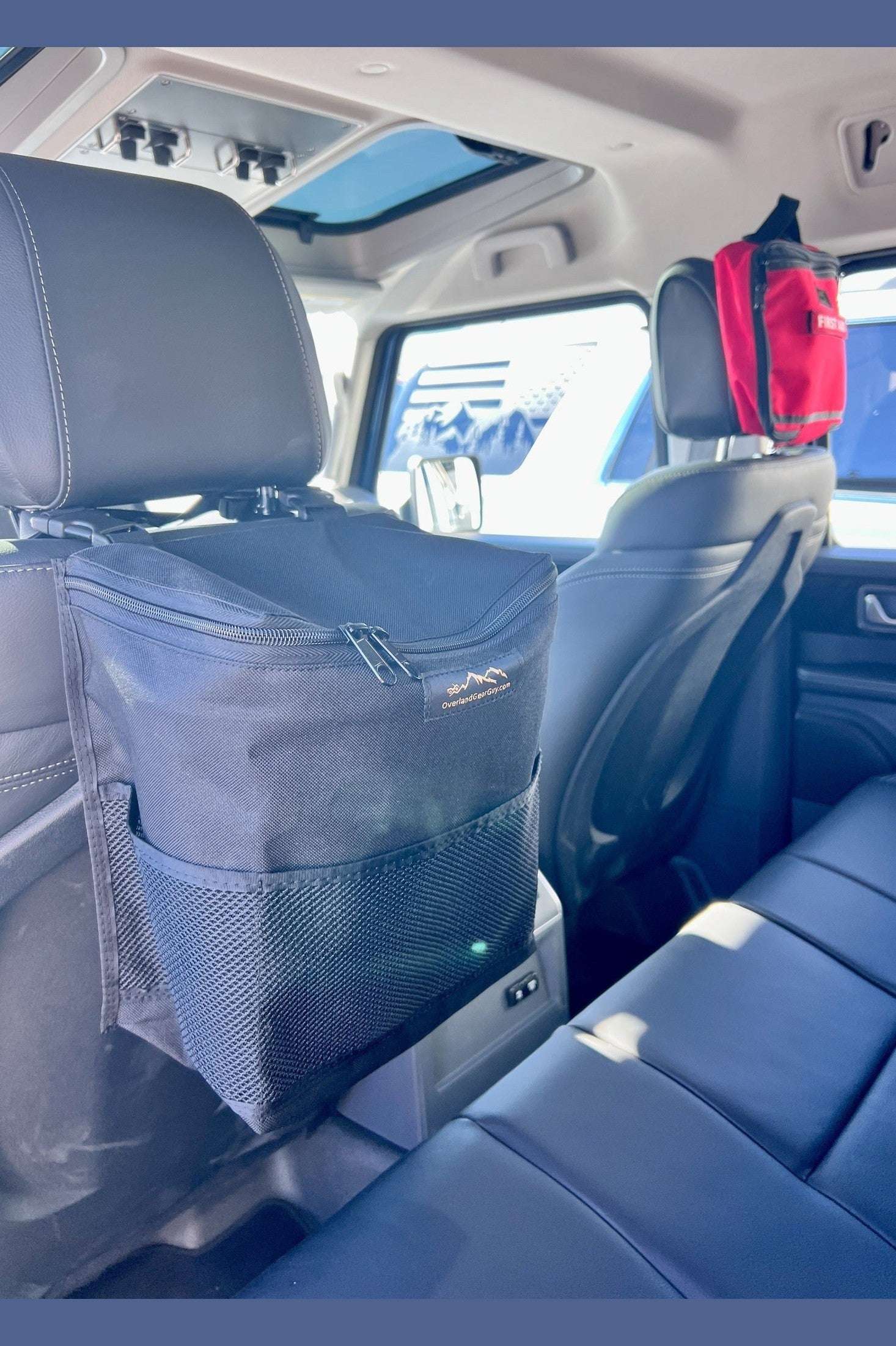 Small Headrest Trash Bag attached to car seat headrest with dual quick release buckles, black color, compact vehicle trash storage solution