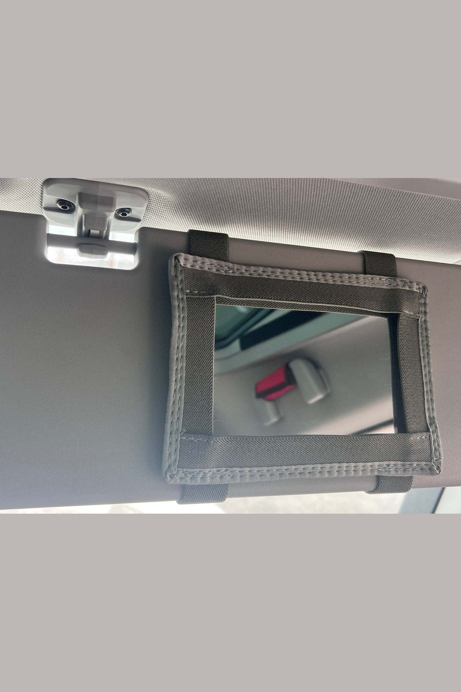 INEOS Grenadier passenger side visor mirror holder, easy installation, durable, improves visibility.