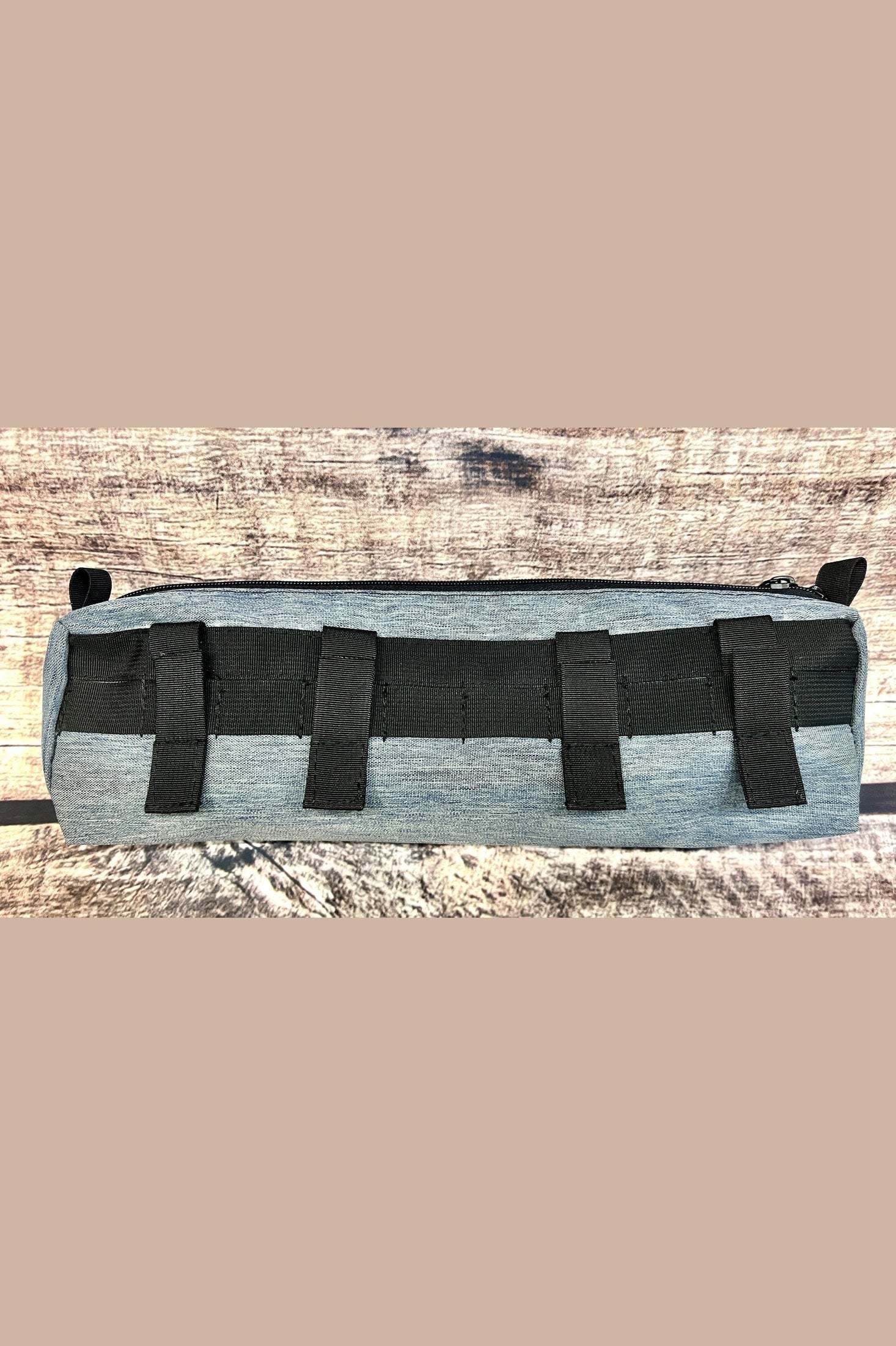 Large grey MOLLE storage cubby pouch with black webbing loops designed for Sprinter van organization