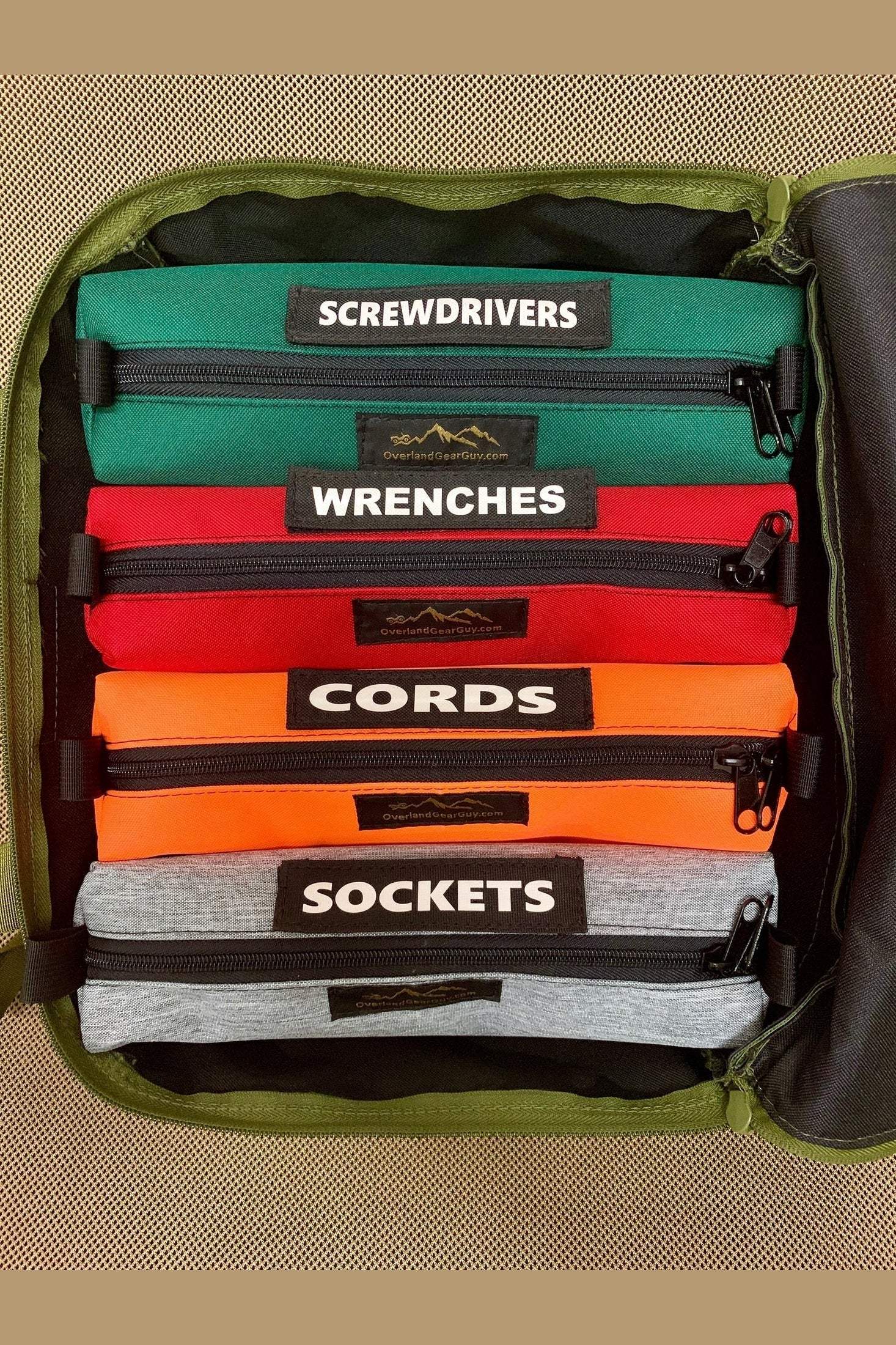 GPC Tool Bag with labeled removable pouches for screwdrivers, wrenches, cords, and sockets organized inside a green durable bag