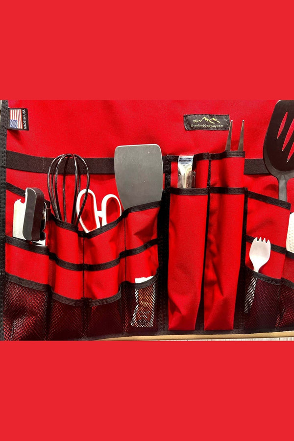 Overlander Utensil Organizer in red with multiple pockets holding various cooking utensils for camping kitchens