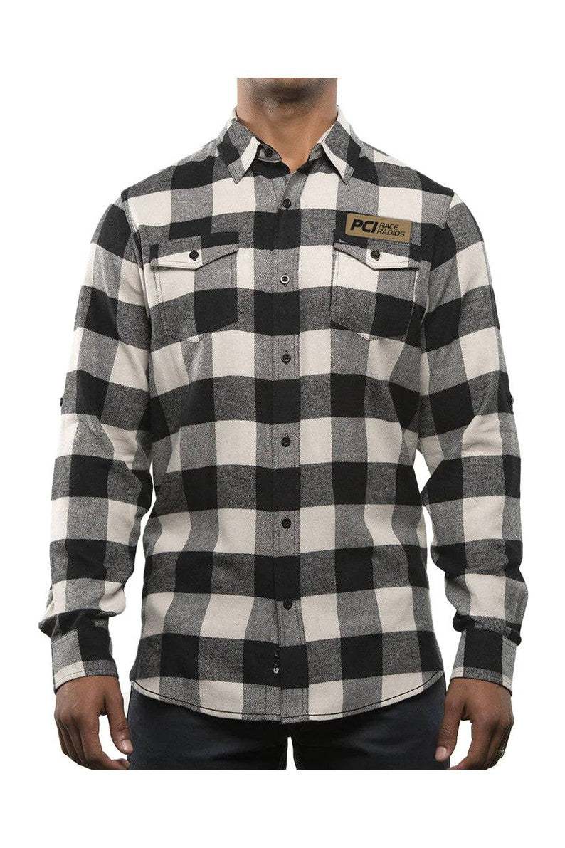 Black and gray PCI flannel shirt with leather logo patch and buttoned flap pockets.