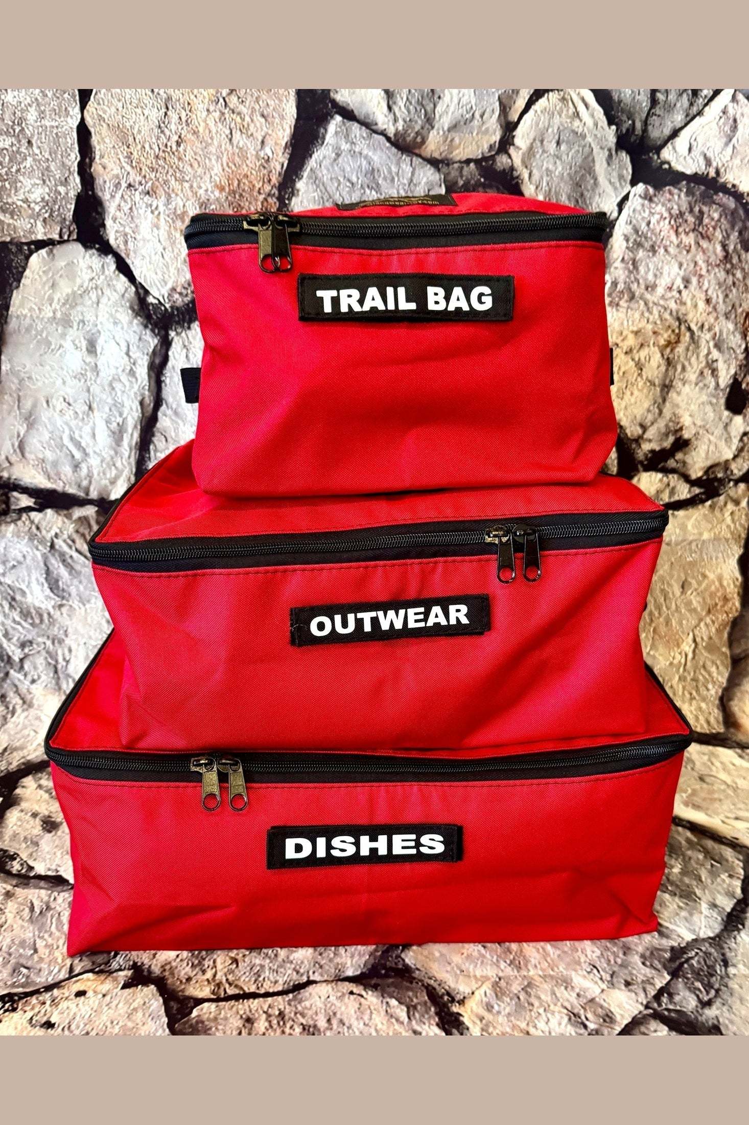 Red Overland Storage Cube Set with labeled compartments for trail bag, outwear, and dishes, designed for outdoor gear organization