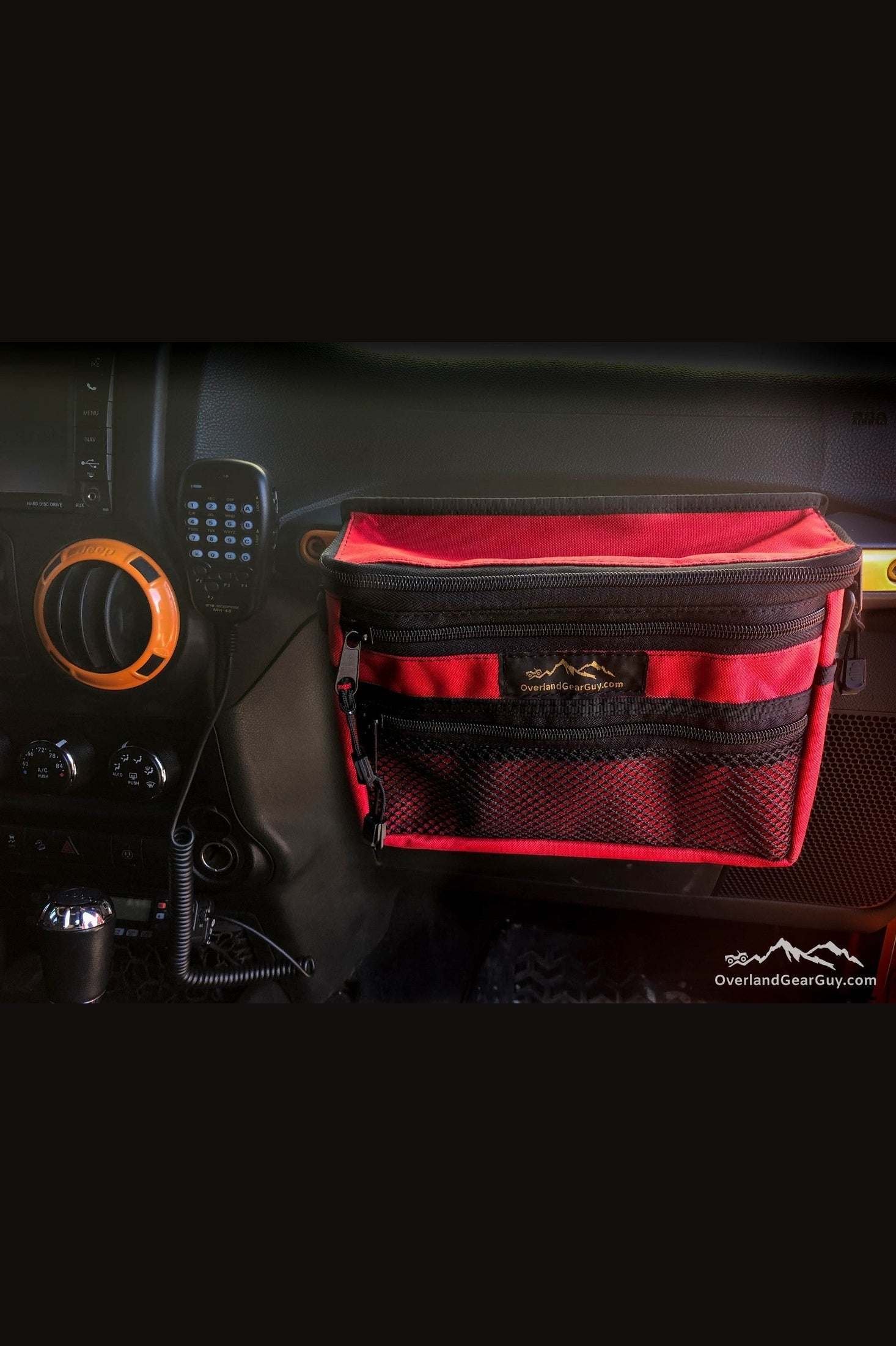 Jeep Grab Handle Pouch in red attached to vehicle grab bar with multiple storage compartments and zipper pocket