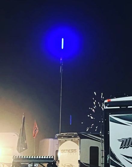 4’ Mwhips Bluetooth color changing LED camp locator whip glowing blue on RV at night