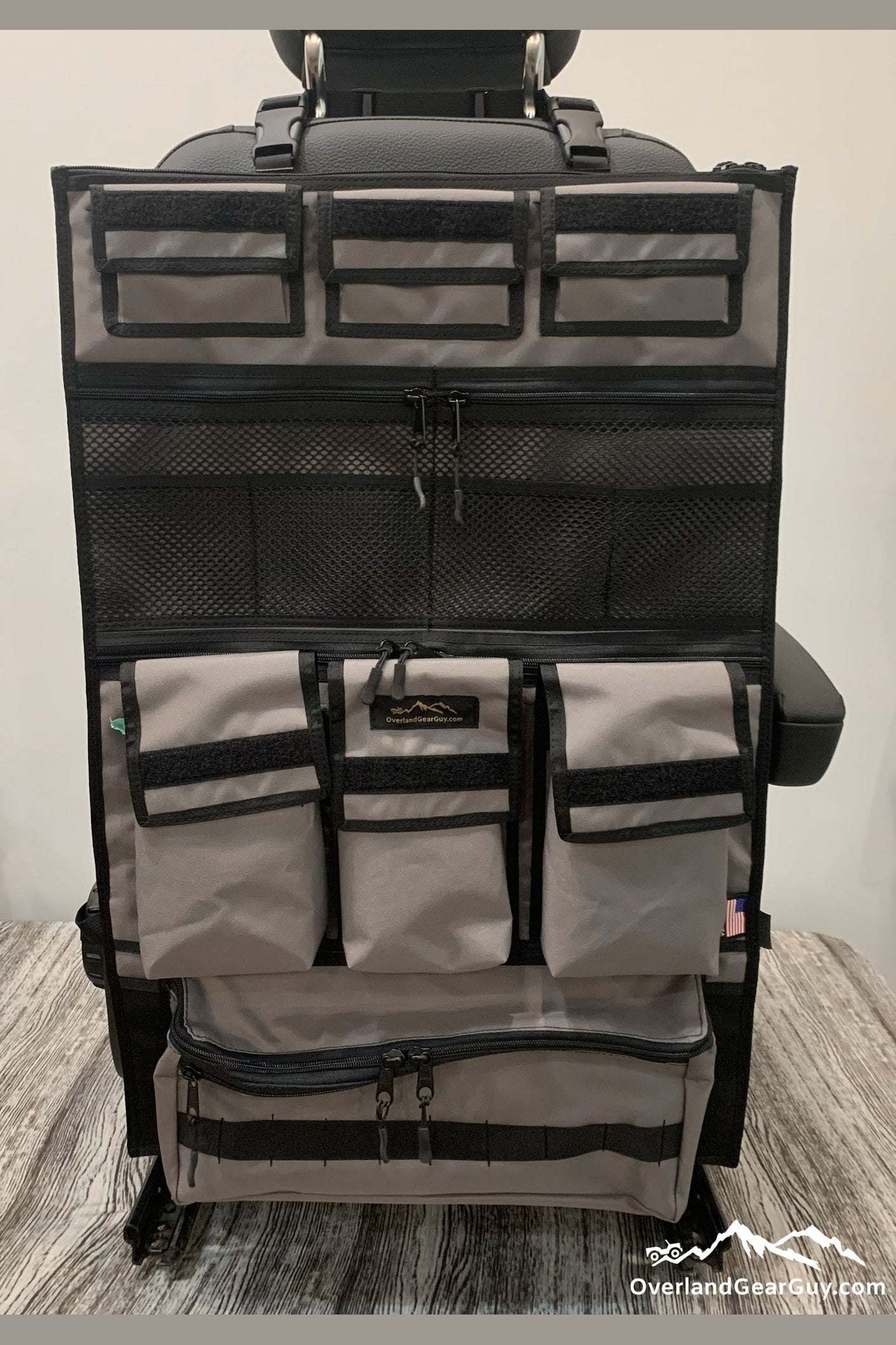 Adventure Ready 3 Seat Organizer with multiple zippered and mesh pockets for vehicle storage and easy access.