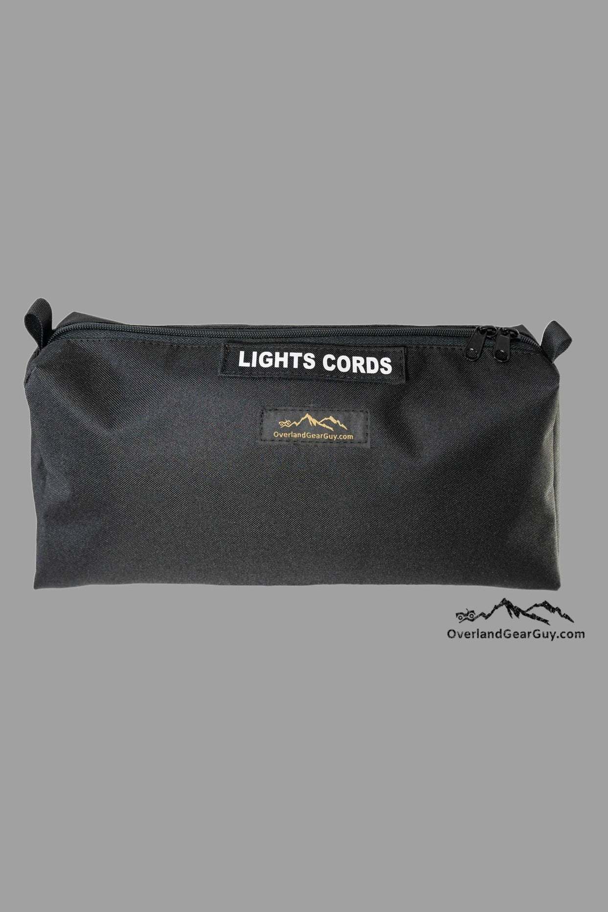 Black Overland Storage Bag Mini for organizing gear with durable, compact design and labeled "LIGHTS CORDS" compartment