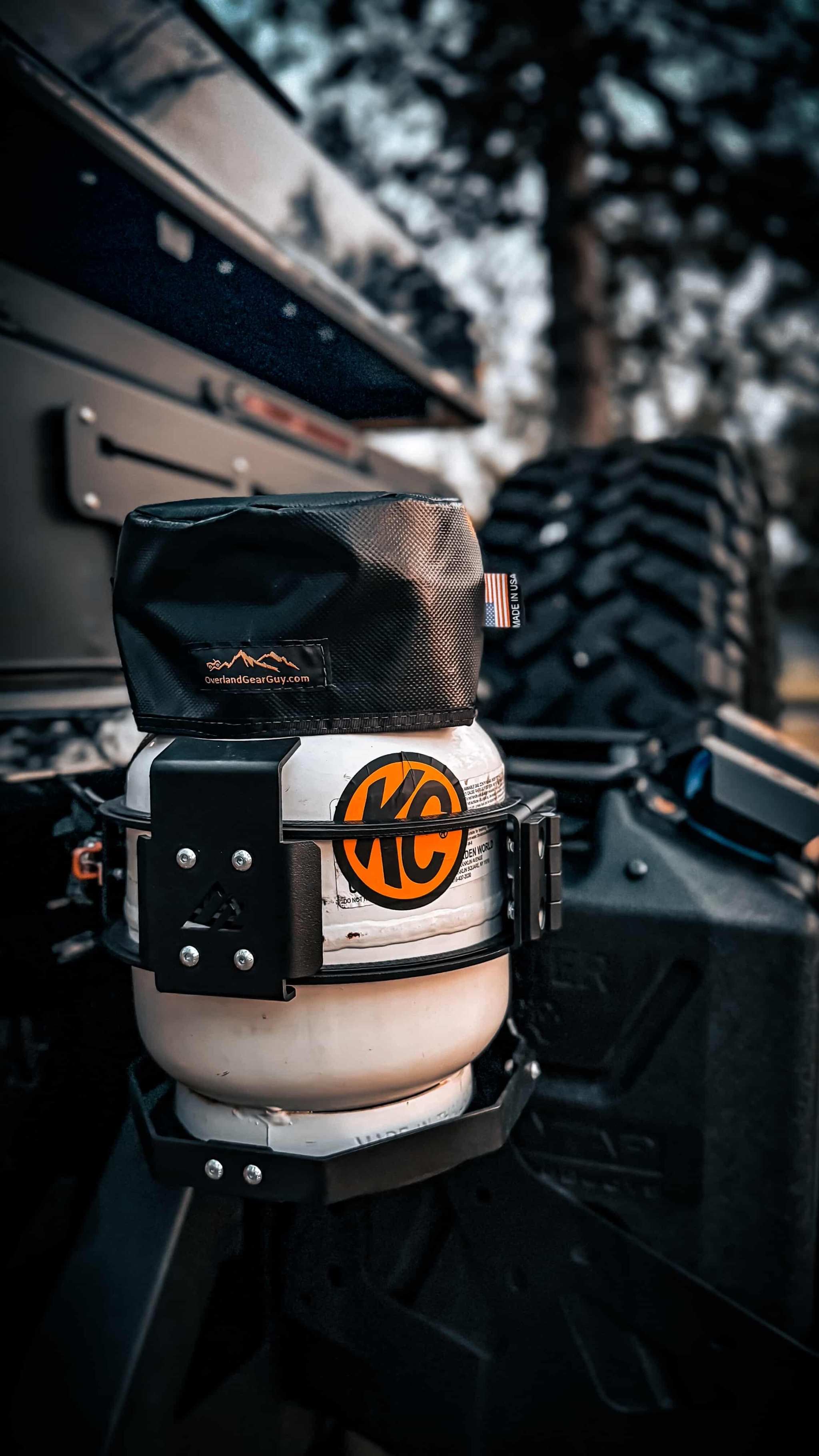 Propane cylinder with black fade resistant tank top cover on vehicle mount