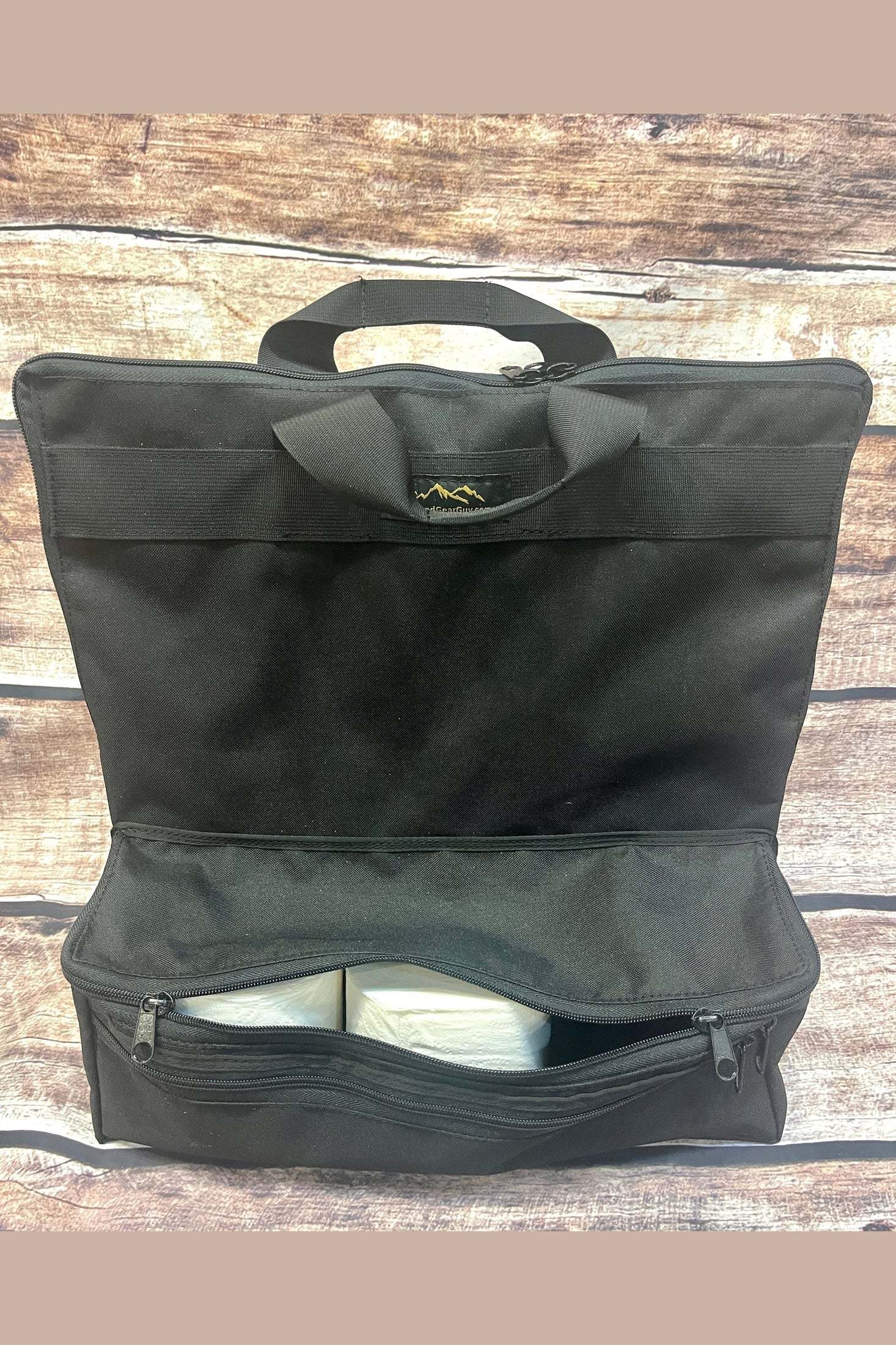 Black Thunder Box Toilet Bag Deluxe with zippered compartments for organizing toilet paper and wipes, designed for portable toilet storage and transport.