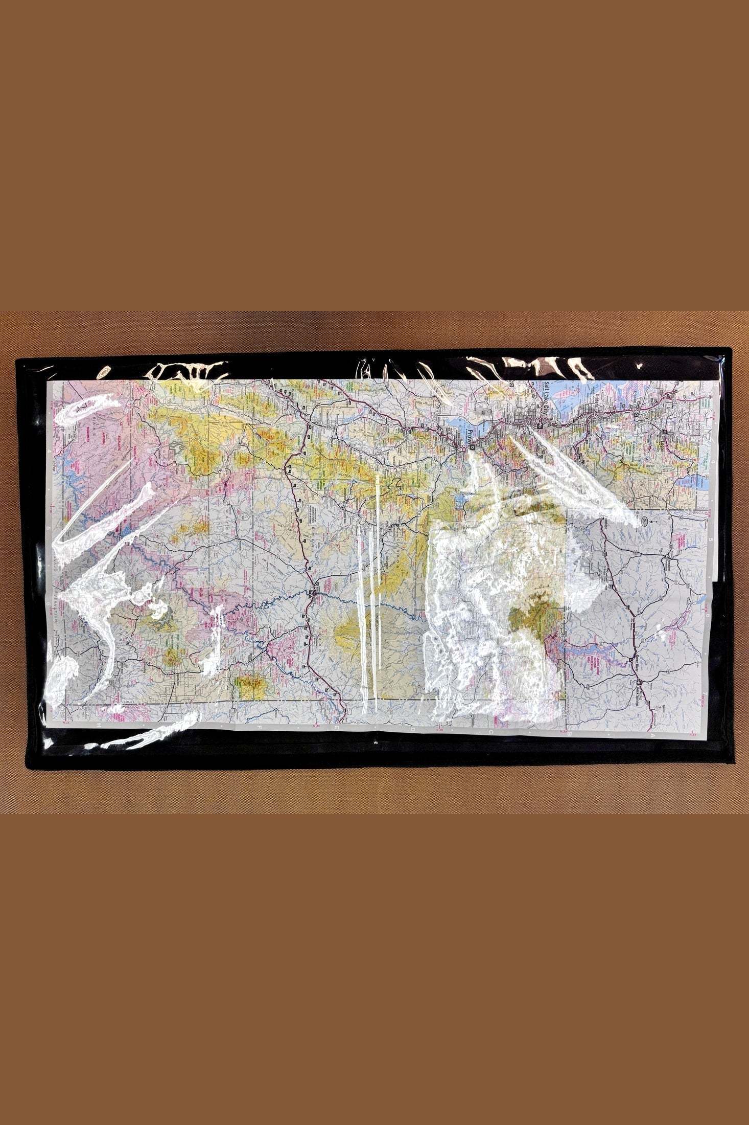 Trail Boss Map Sleeve clear plastic front with oversized map inside protecting navigation maps