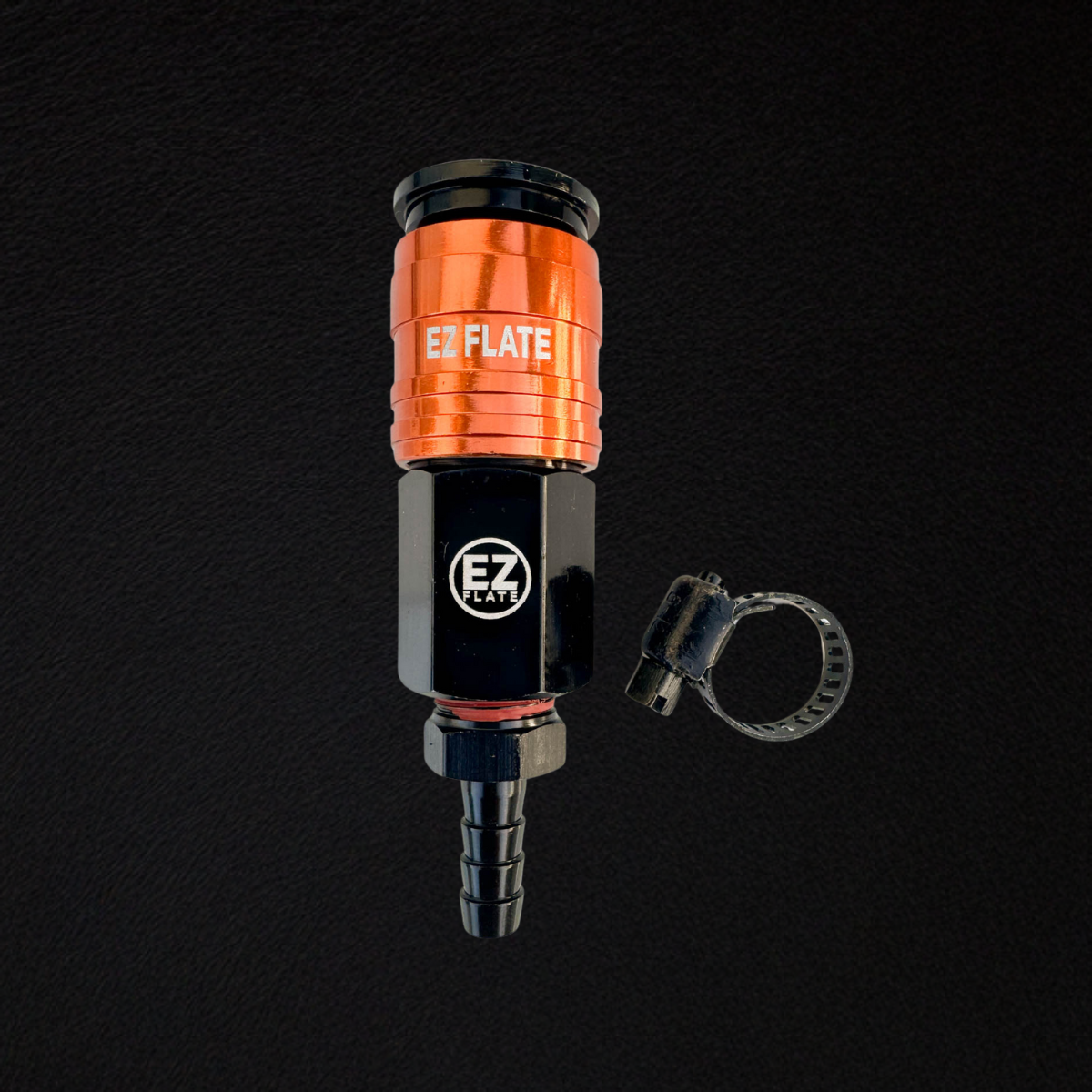 Compact orange and black universal adapter with EZ FLATE branding and hose clamp on black background