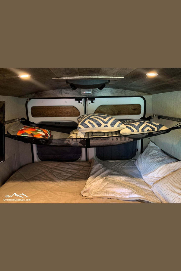 Universal van cargo net securing pillows and blankets inside vehicle storage space