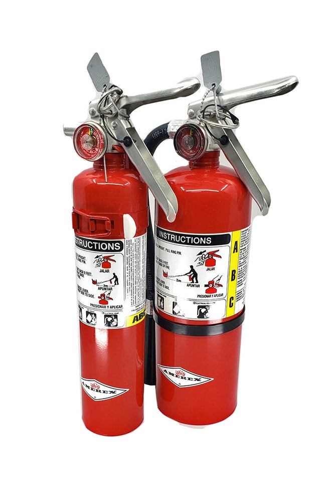 Red fire extinguisher for off-road racing, compact design, reliable ABC dry chemical suppression, adventure safety.