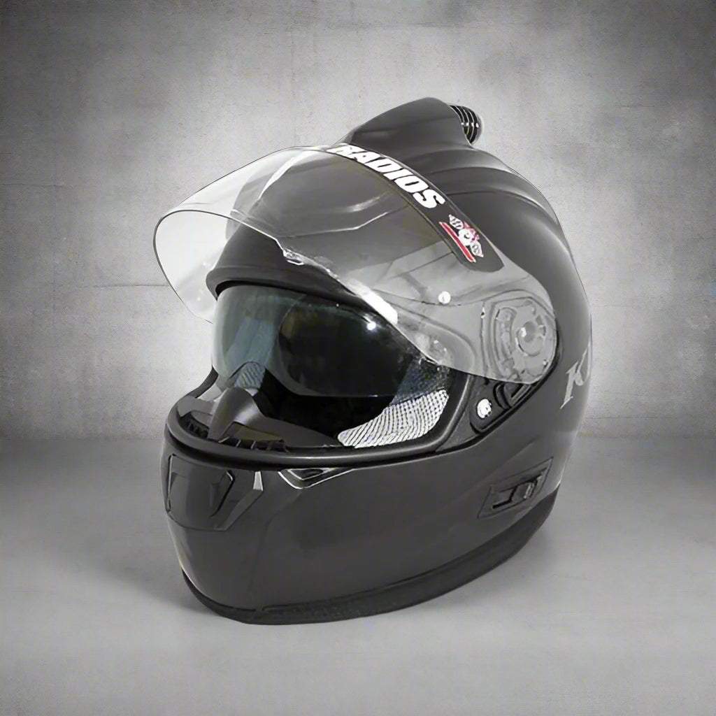 Clearance Klim R1 Fresh Air Helmet in flat black with minor scratches, featuring wired communication, DOT and ECE certified, polycarbonate shell, removable liner, and built-in sun visor