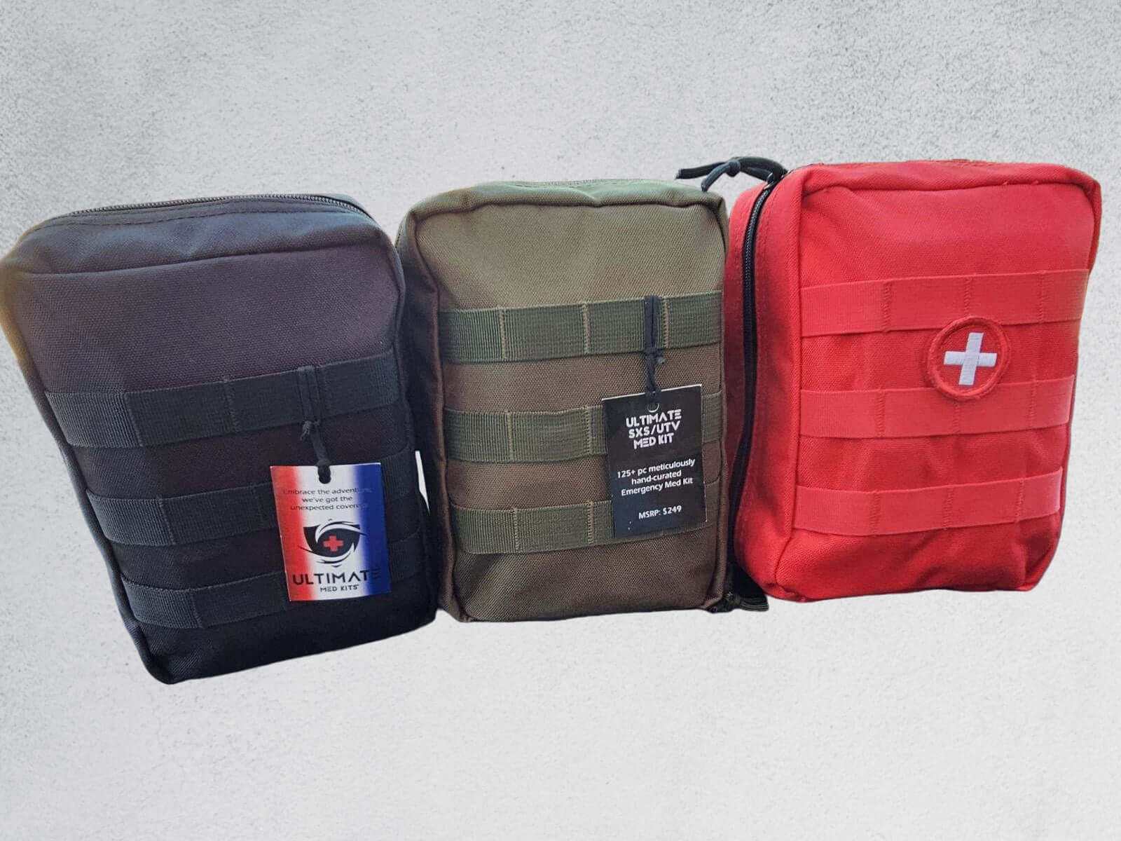 Compact Ultimate Med Kits in black, green, and red with durable fabric for off-road first aid preparedness