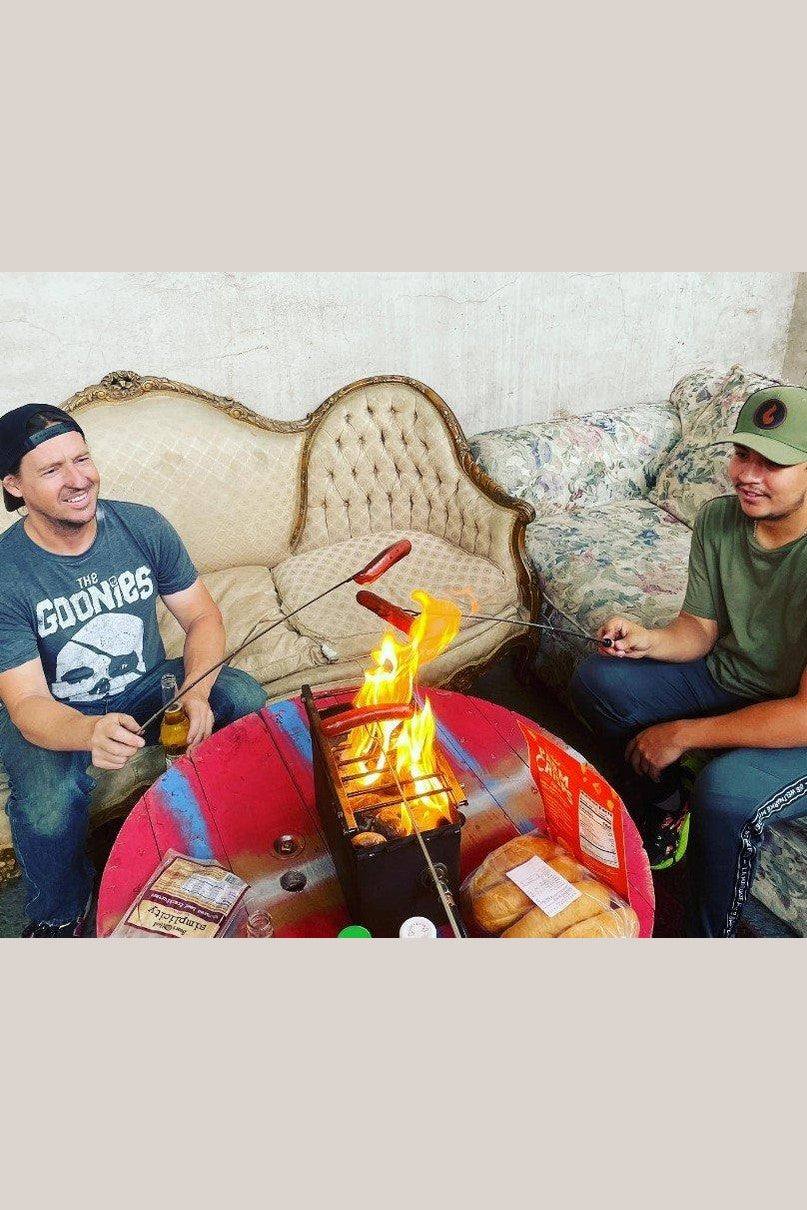 extendable roasting skewers in use at campfire