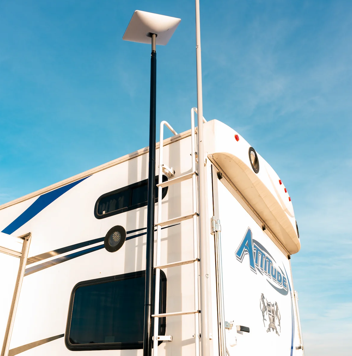 Starlink Mount Generation 2 Kit with steel pole installed on RV roof against blue sky